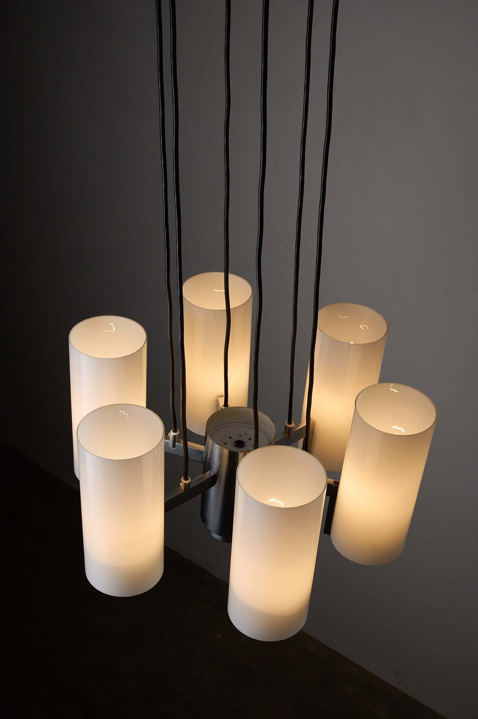 Space Age chrome chandelier with six cylindrical opaline glass shades and polished chrome finish.