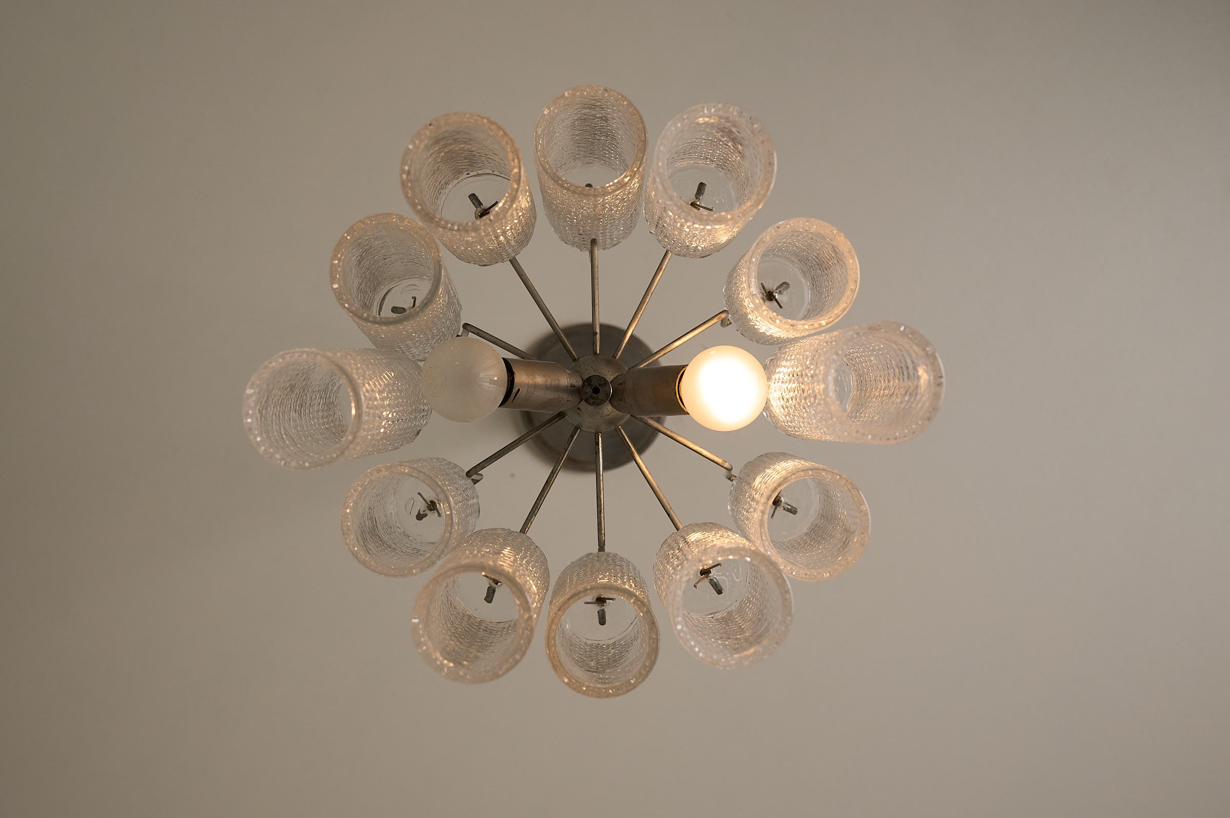 Twelve-Tube Spiral Pattern Glass Chandelier, Italy, 1960s with molded spiral tubes and metal frame.