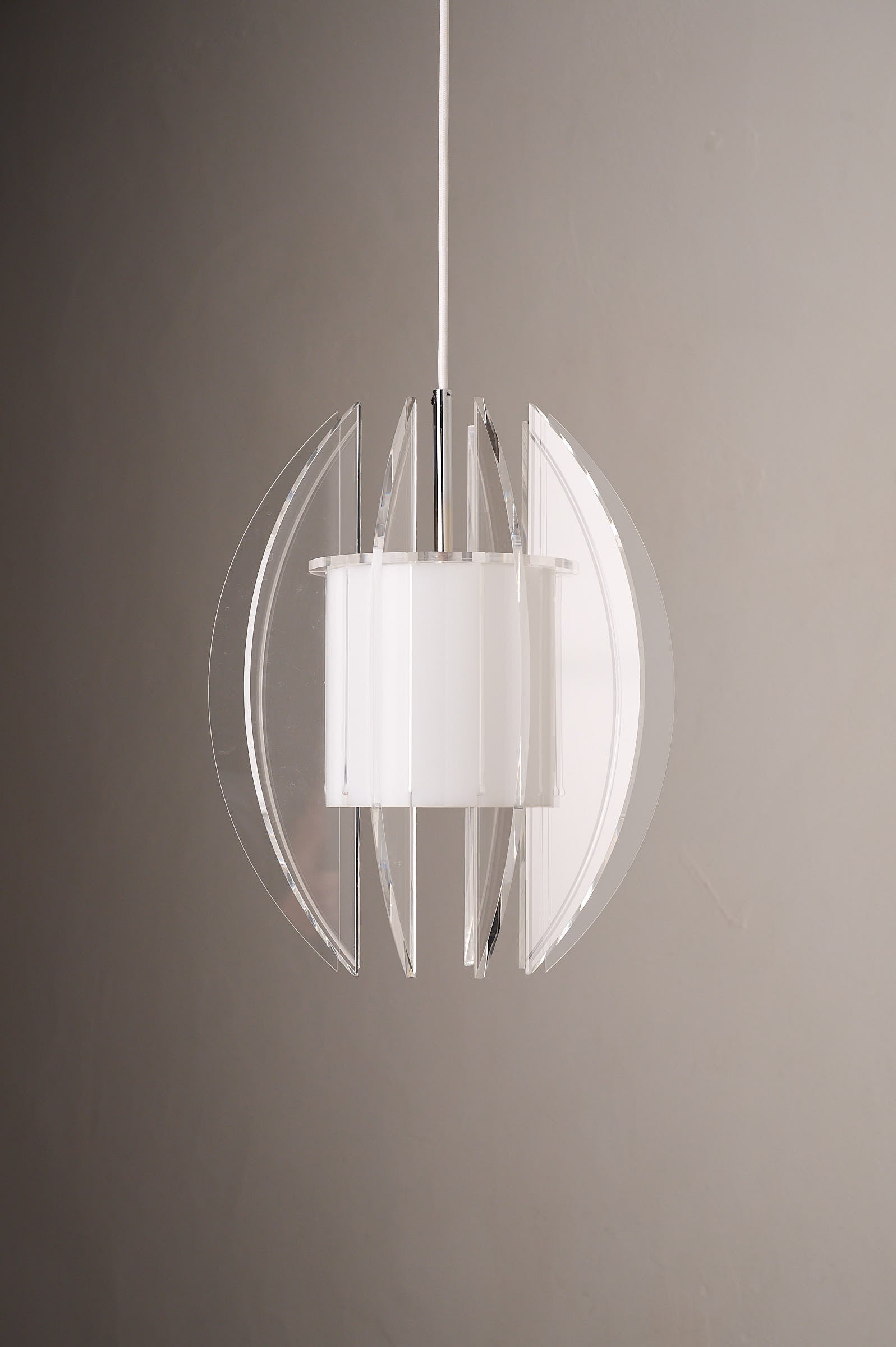 Space Age Acrylic and Perspex Pendant Lamp, 1970s hanging in a modern setting with clear fins and opal diffuser.