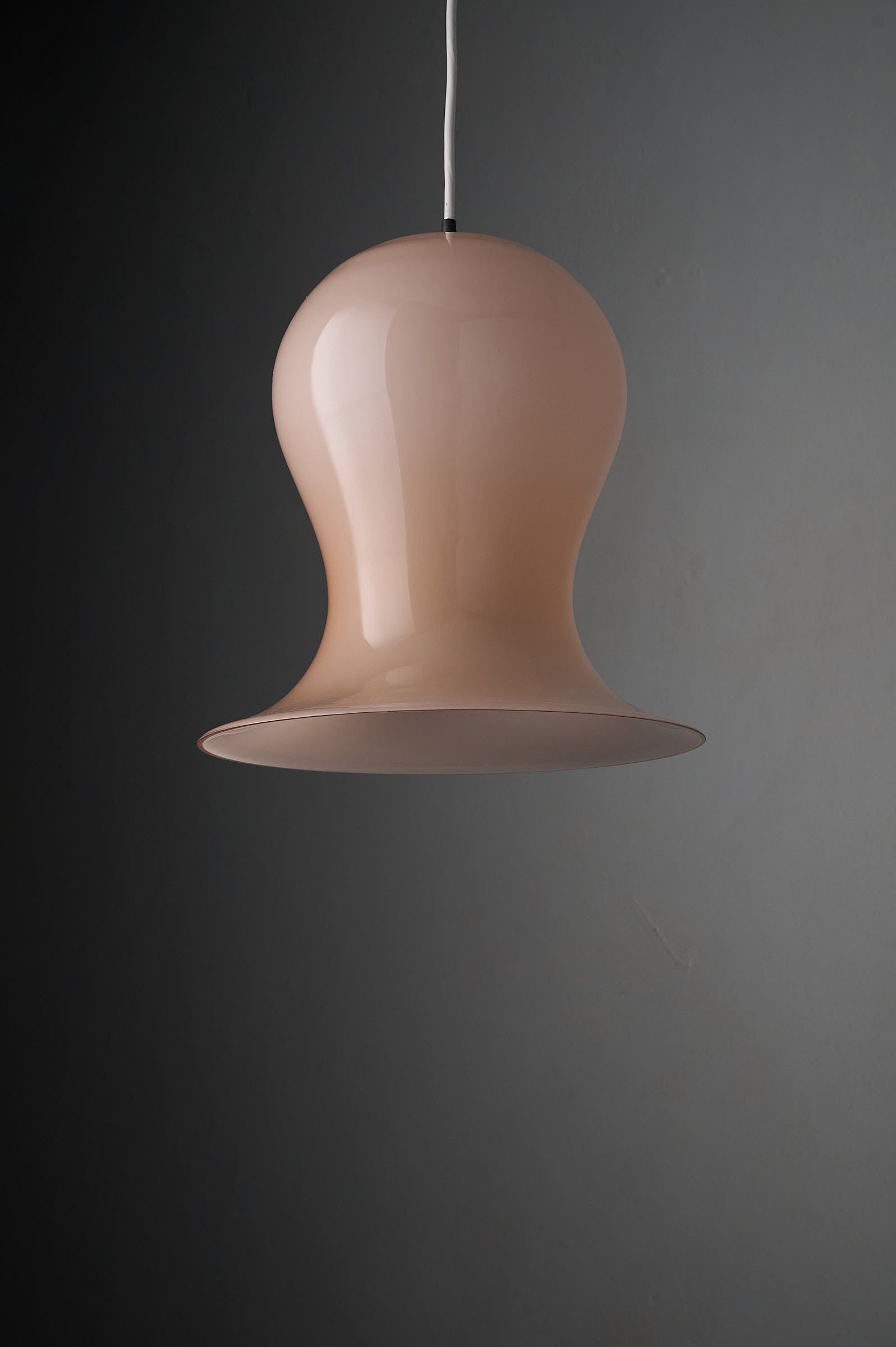 Bell-Shaped Glass Pendant in Dusty Rose, 1970s hanging lamp with a unique organic silhouette.