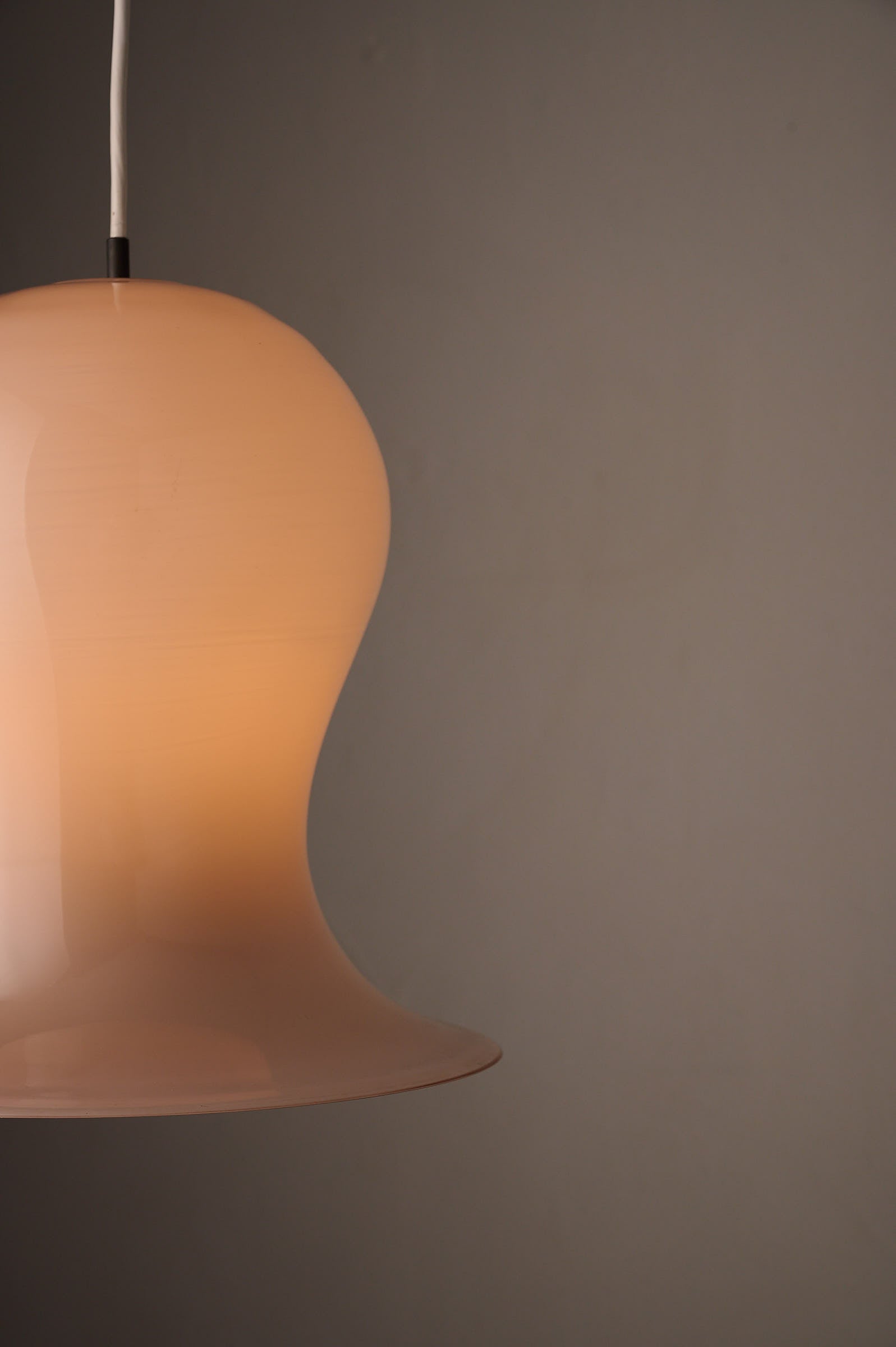 Bell-Shaped Glass Pendant in Dusty Rose, 1970s showcasing a hand-blown cased glass design.