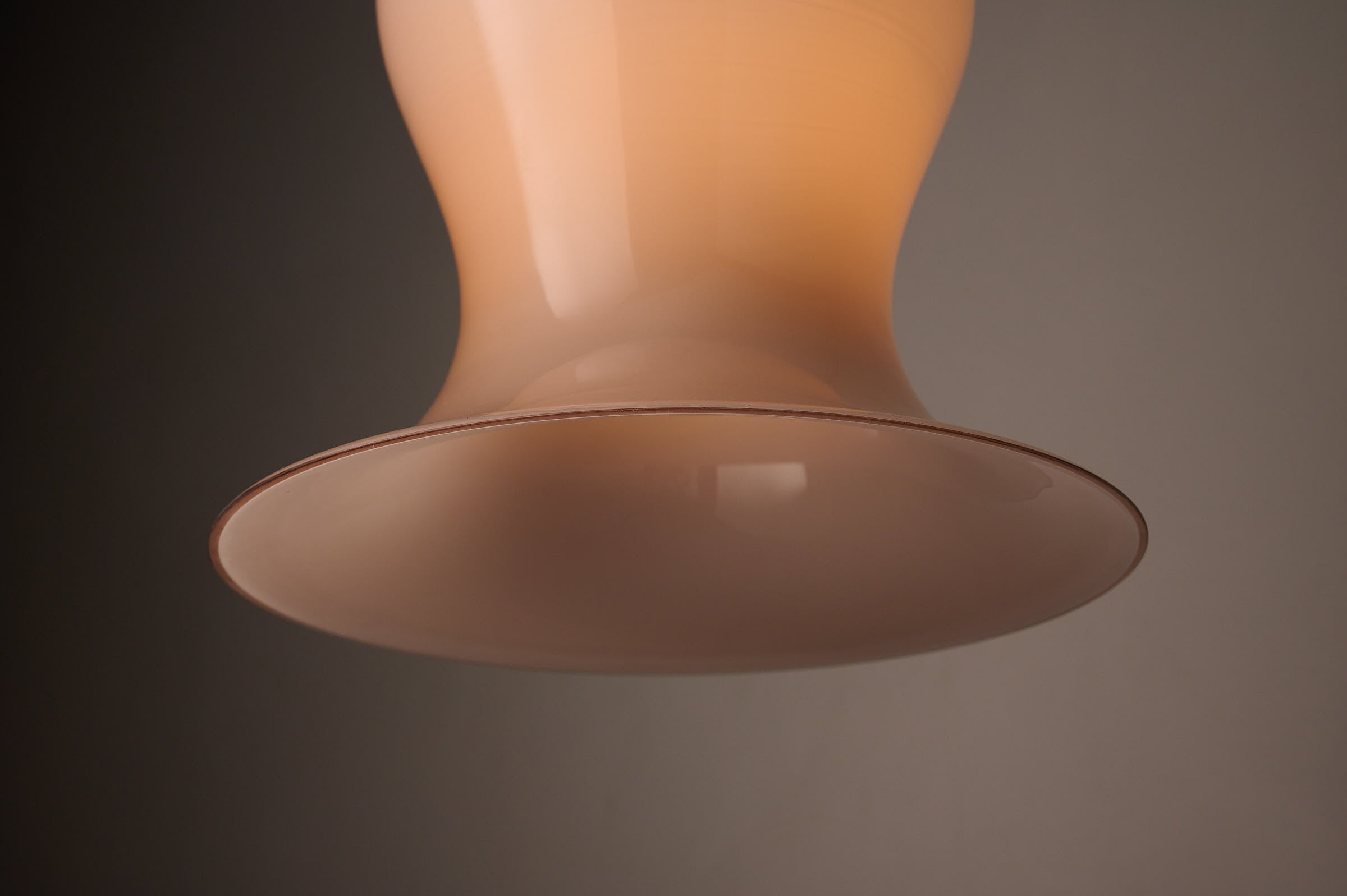 Bell-Shaped Glass Pendant in Dusty Rose, 1970s with a voluminous hand-blown shade.