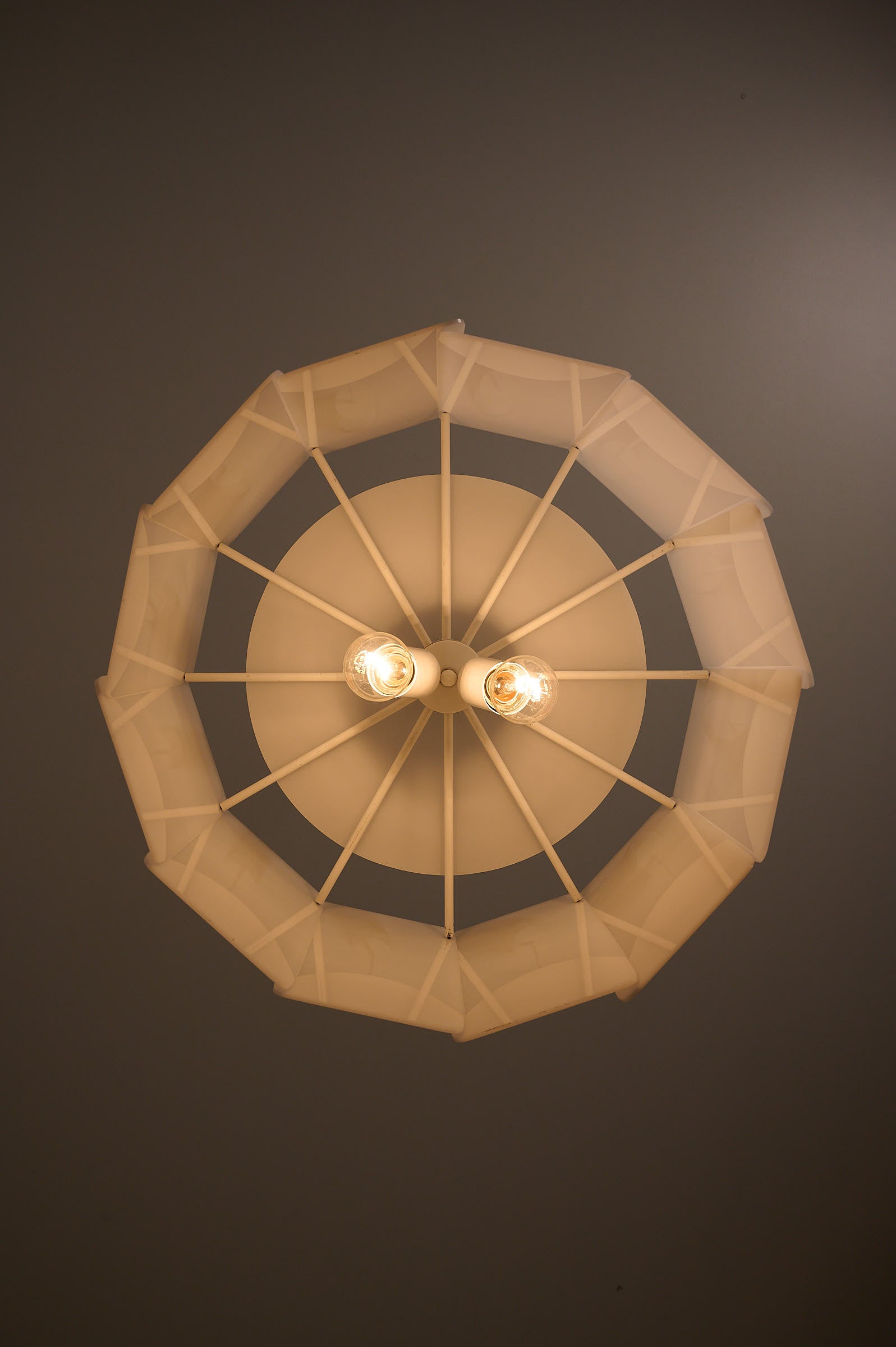 Acrylic Panel Drum Pendant, Germany, 1970s viewed from below, showcasing twelve translucent acrylic panels and bulb arrangement.