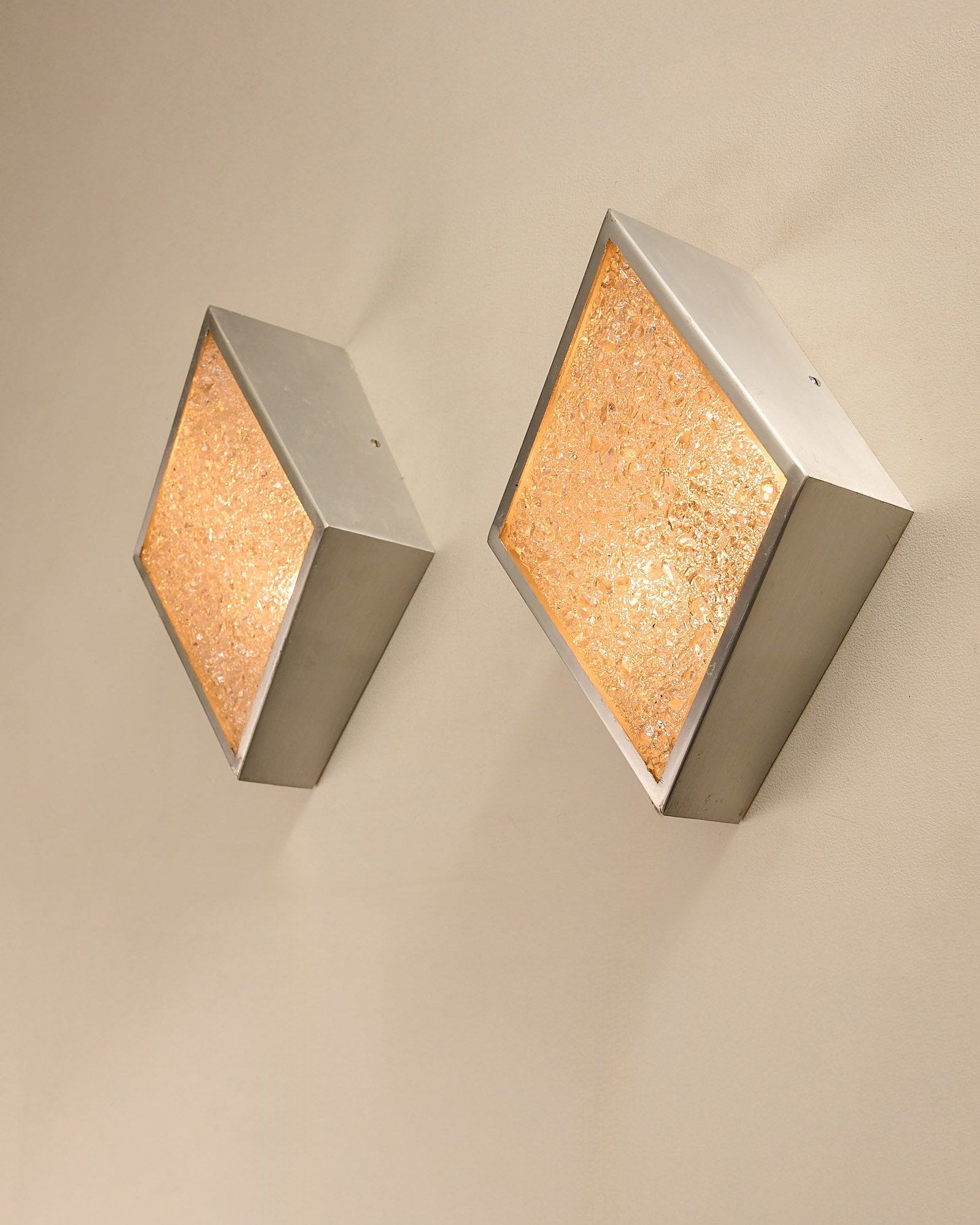 Diamond Wall Lights in Structured Glass and Aluminium, Germany, 1970s mounted on a wall.