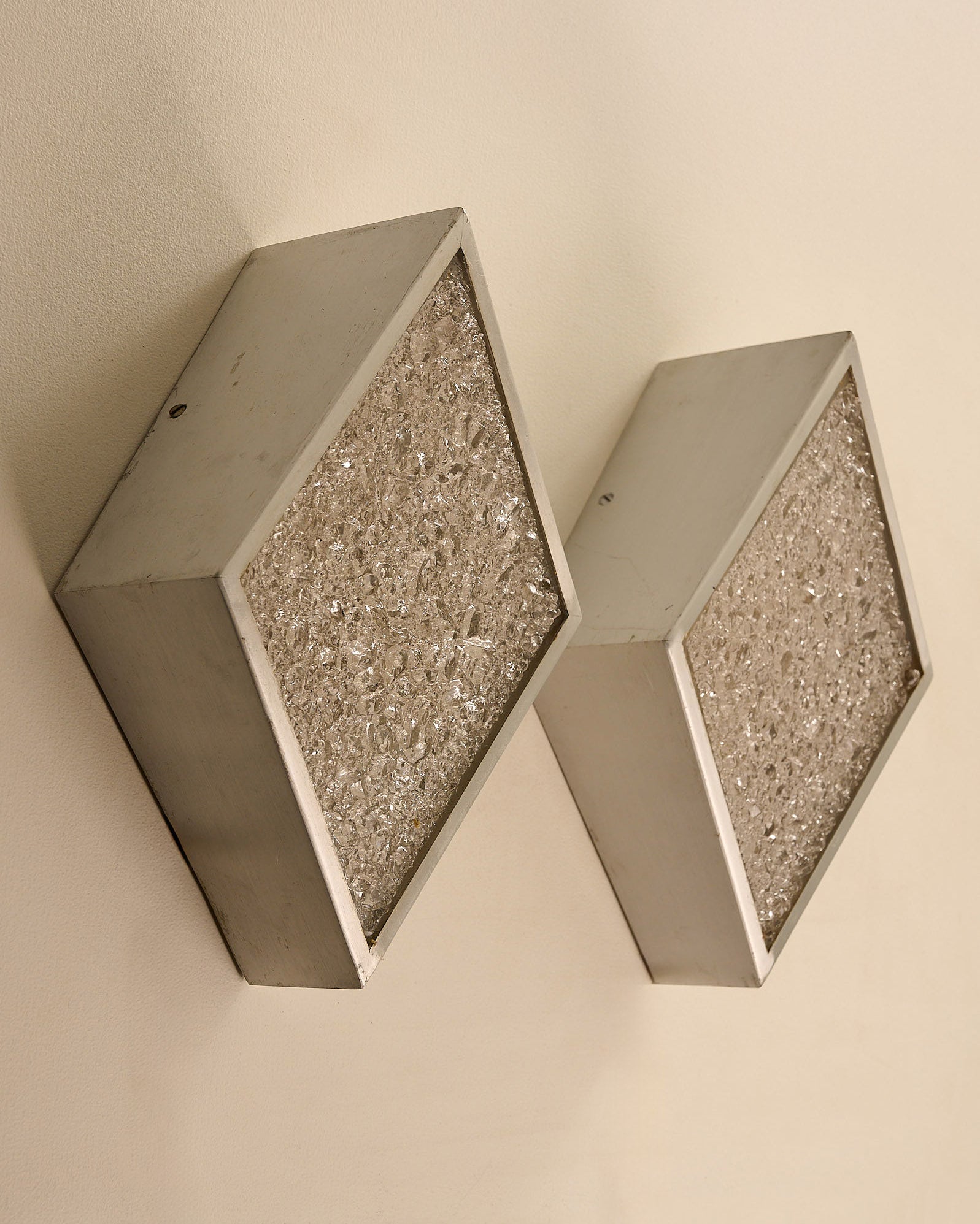 Diamond Wall Lights in Structured Glass and Aluminium, Germany, 1970s mounted on a wall.