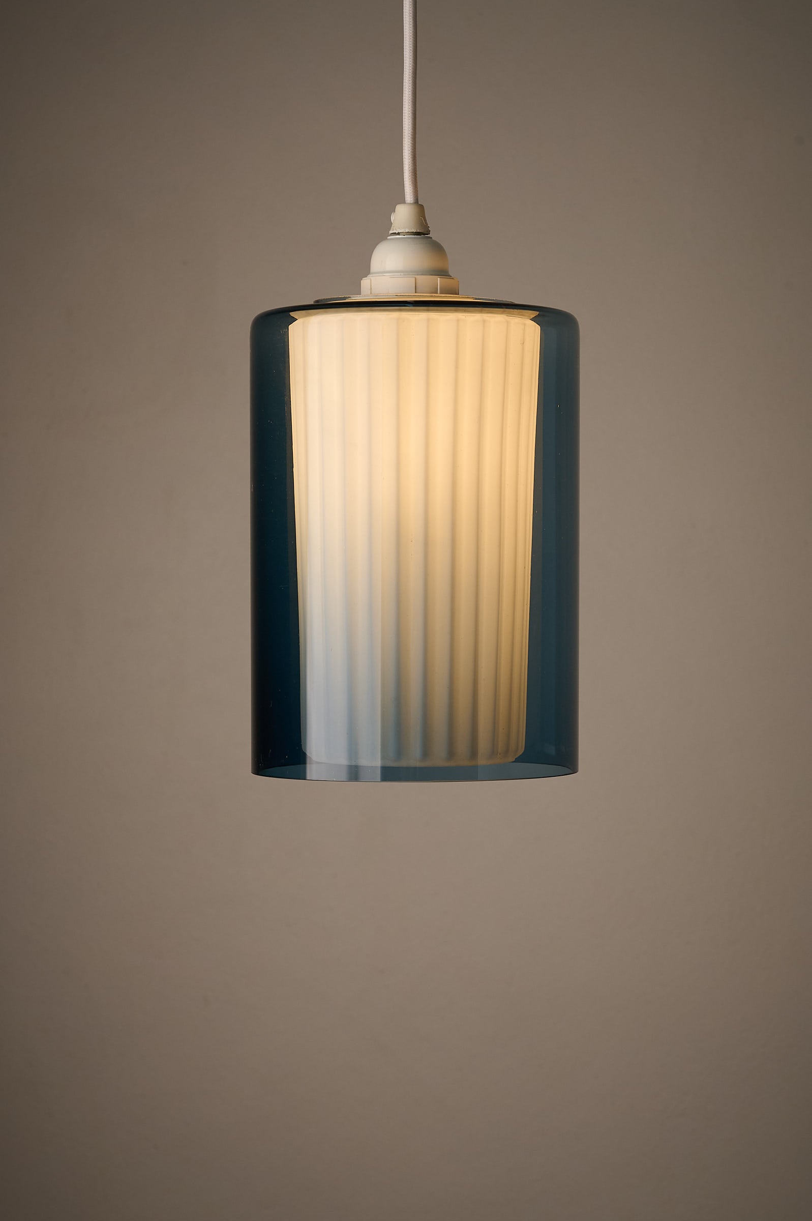 Double Glass Pendant in Blue and Opaline, Europe, 1960s/1970s, pendant lamp with dual-layer glass design.