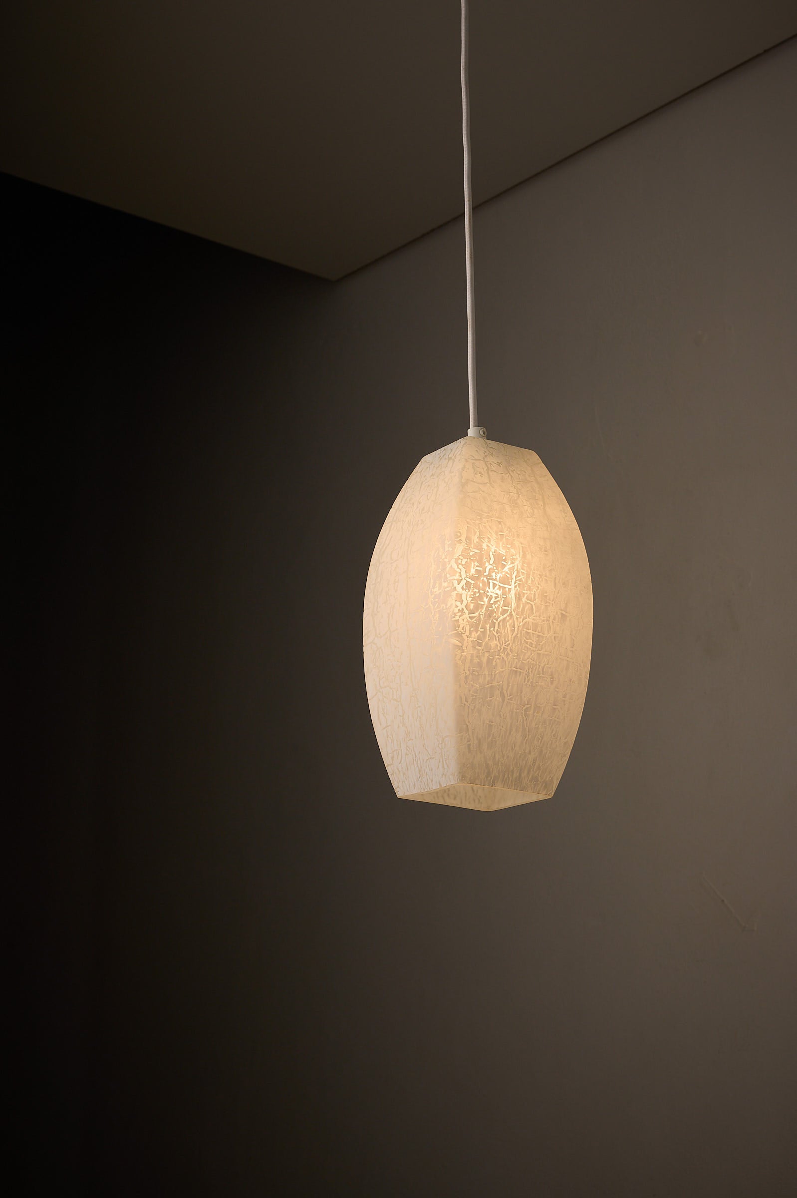 Trio of Ovoid Glass Pendants with Crackle Frosted Pattern, Europe, 1960s/1970s, elegant ambient lighting design.
