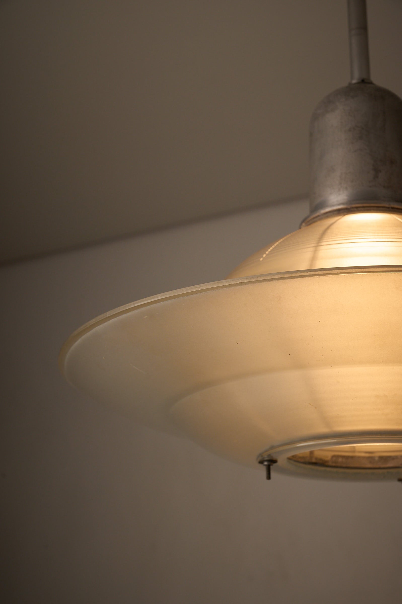 Art Deco Industrial Pendant, 1930s featuring a frosted glass shade in a stylish design.