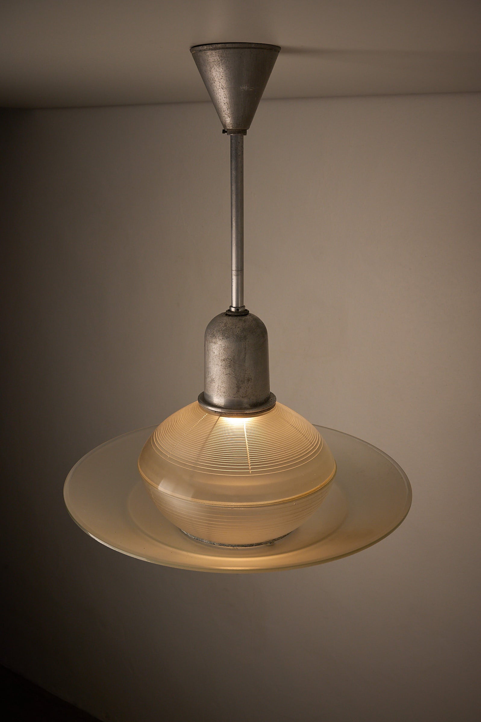 Art Deco Industrial Pendant, 1930s - pendant light with tiered glass shade for optimal light diffusion.