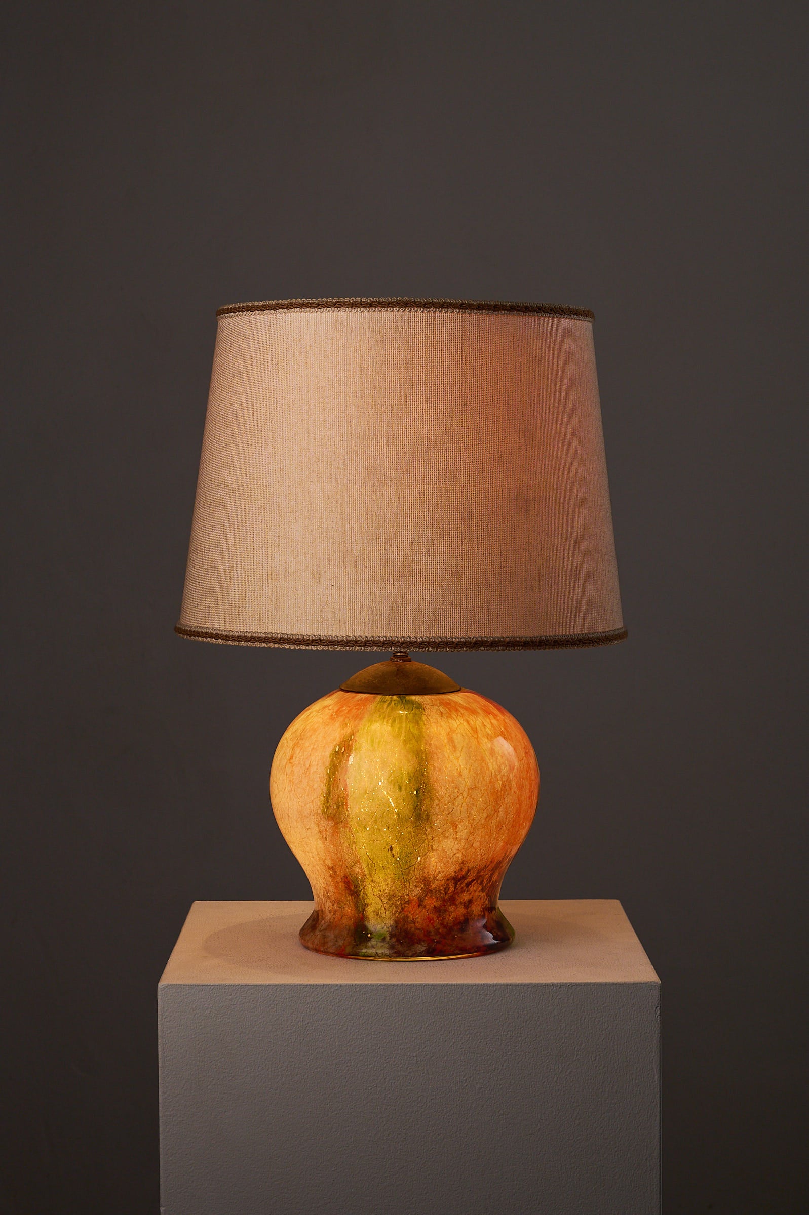 1970s Mid-Century Modern Multicolored Art Glass Table Lamp with a structured beige shade.