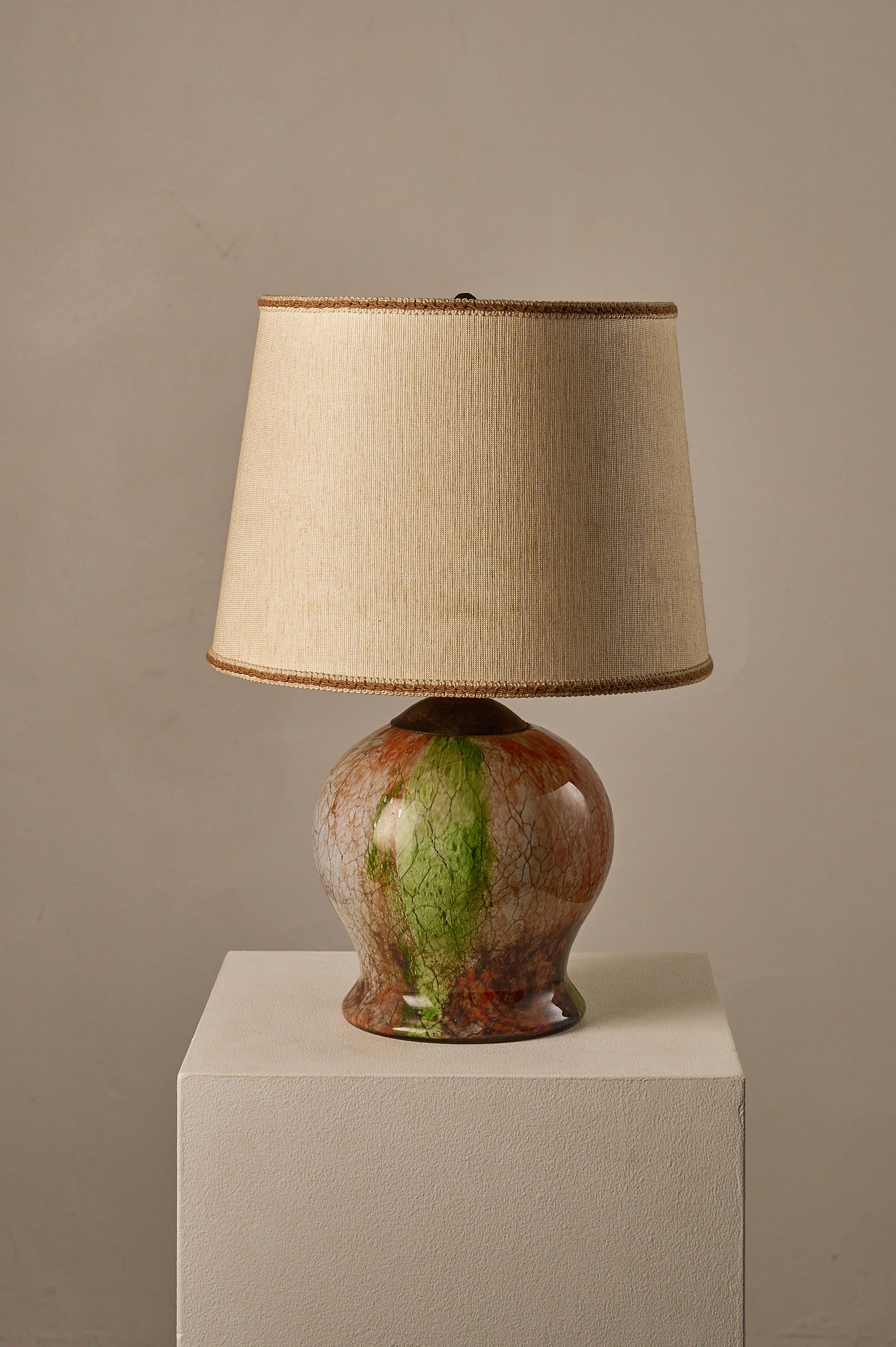 1970s Mid-Century Modern Multicolored Art Glass Table Lamp showcasing a marbled glass base and fabric shade.