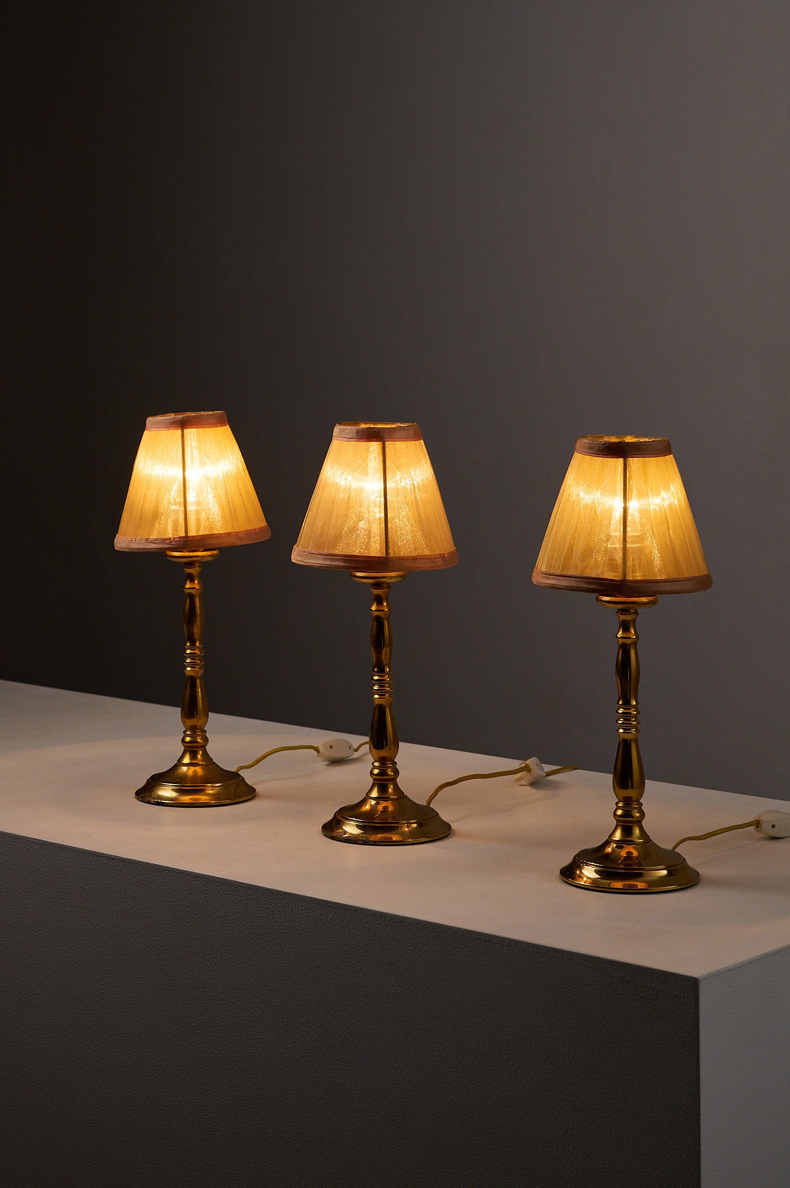 Hollywood Regency Brass Table Lamps, Europe, 1970s featuring pleated shades and warm glow.