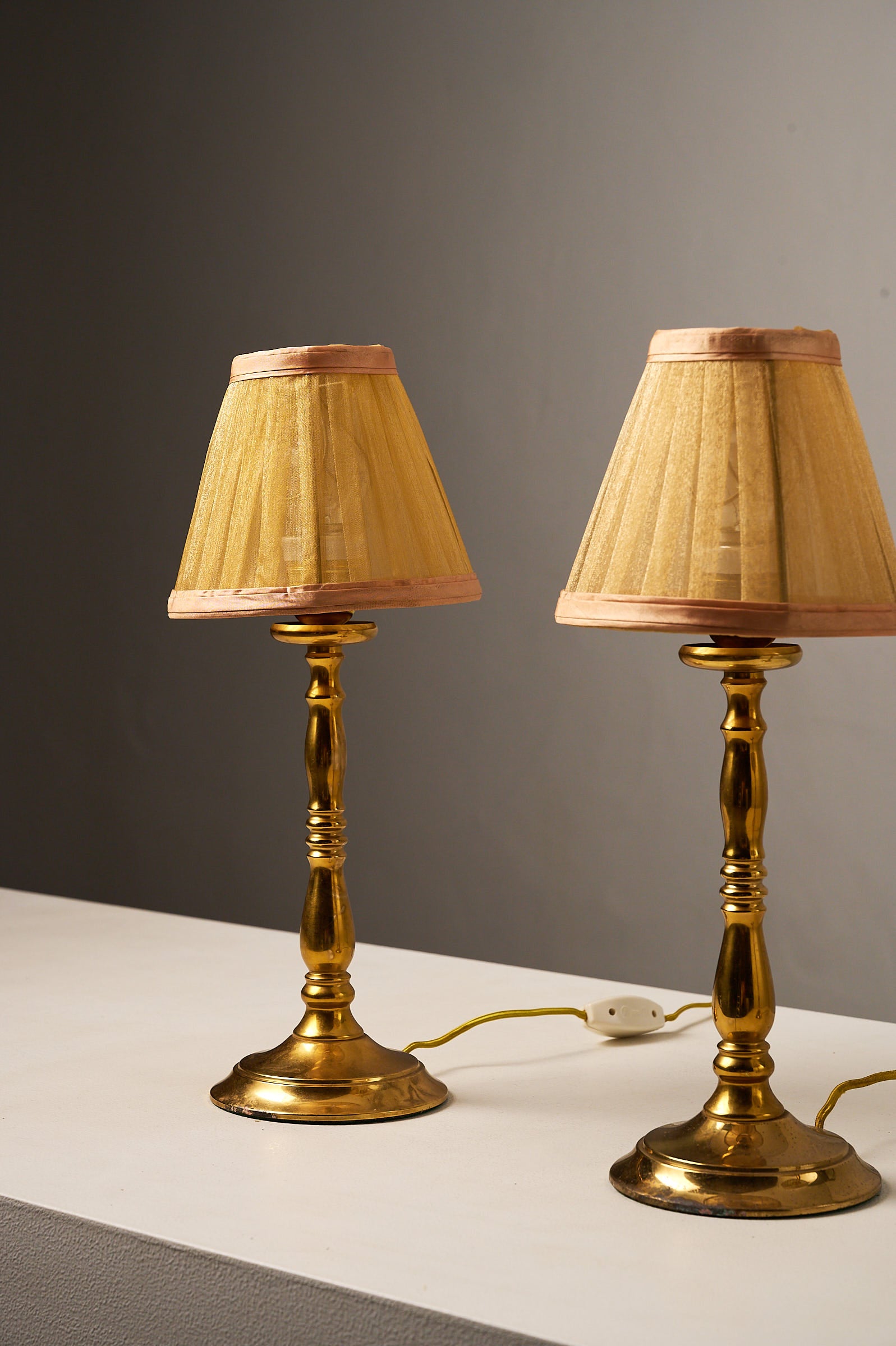 Hollywood Regency Brass Table Lamps, Europe, 1970s showcasing small table lamps with pleated fabric shades.