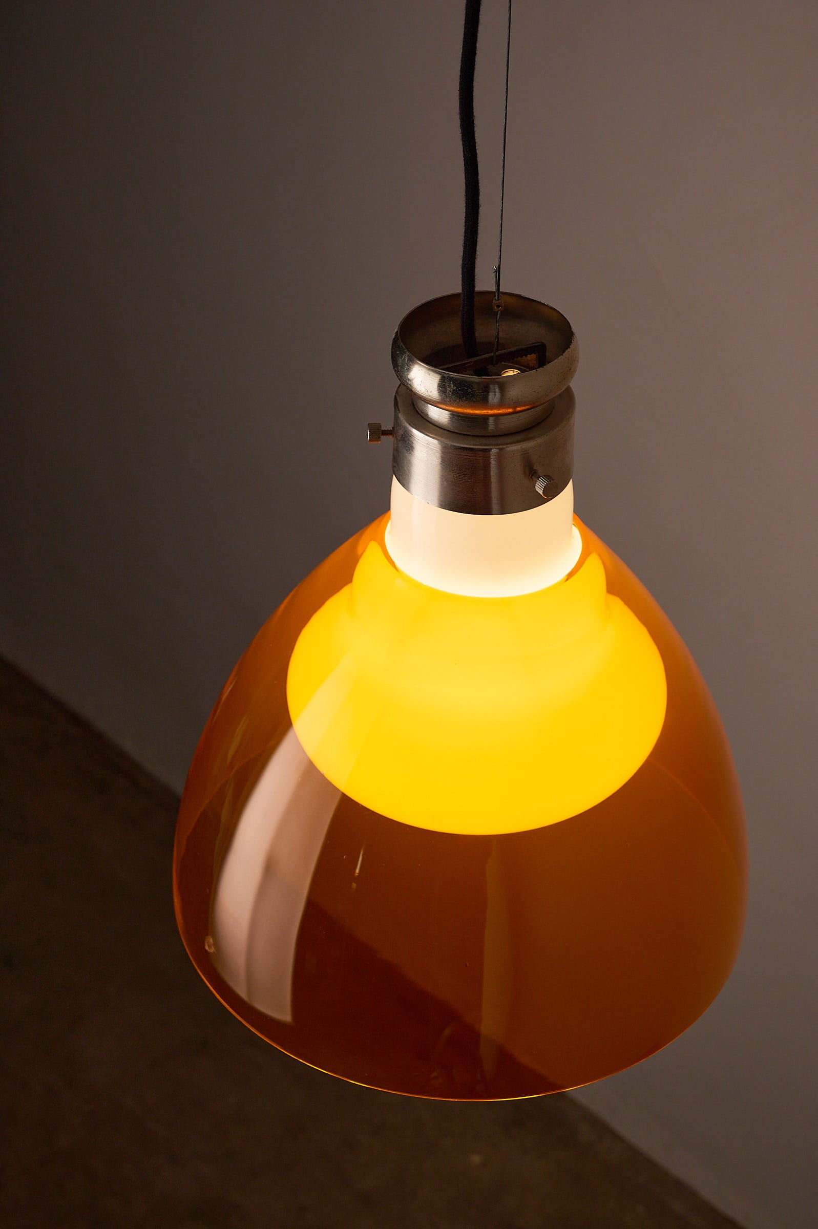 Space Age Blown Glass Pendant Lamp by Vistosi, Italy, 1970s in orange glass with opaline inner shade.