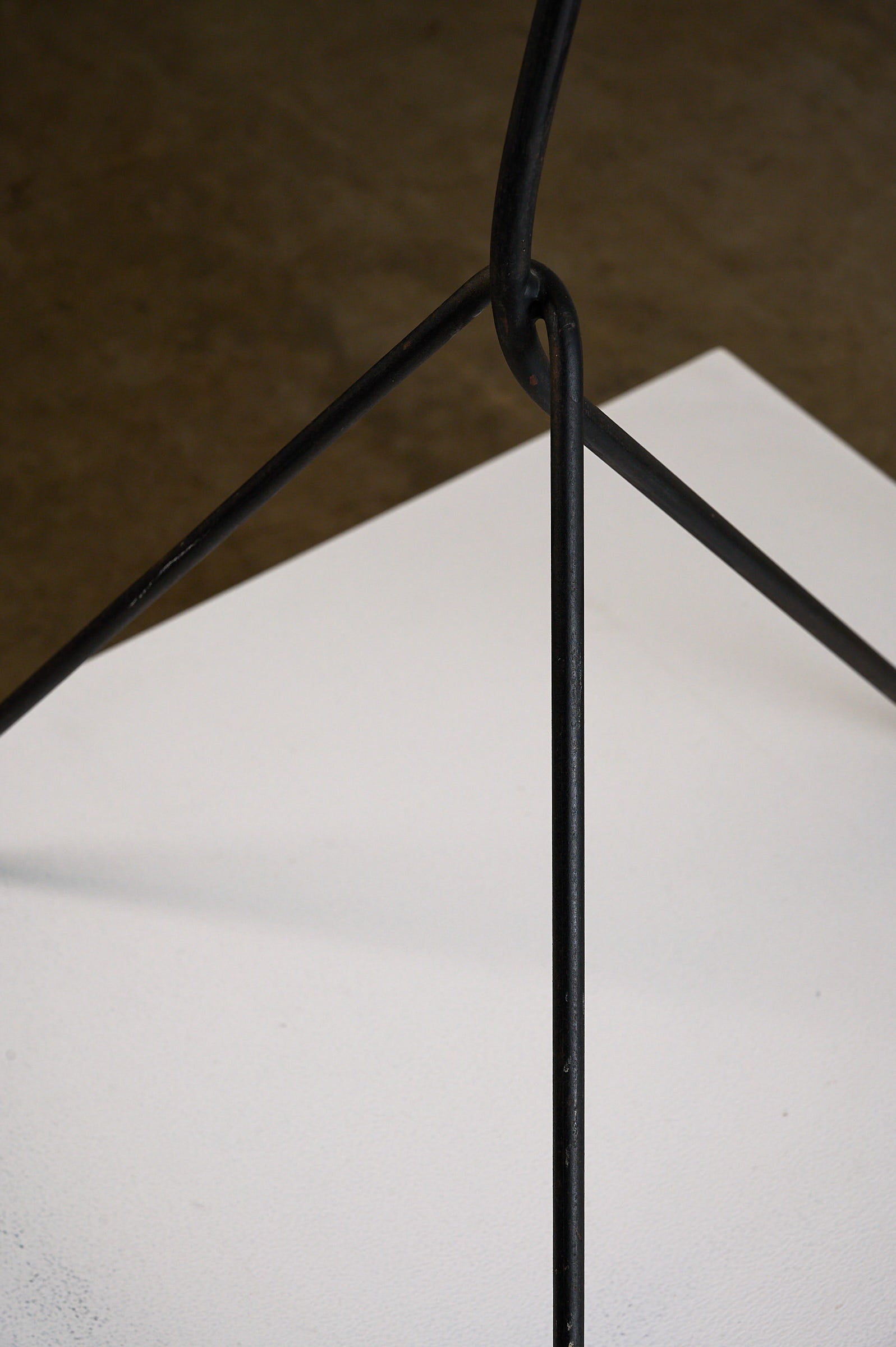 'Grasshopper' Floor Lamp, The Netherlands, 1950s tripod base showcasing black lacquered iron design.