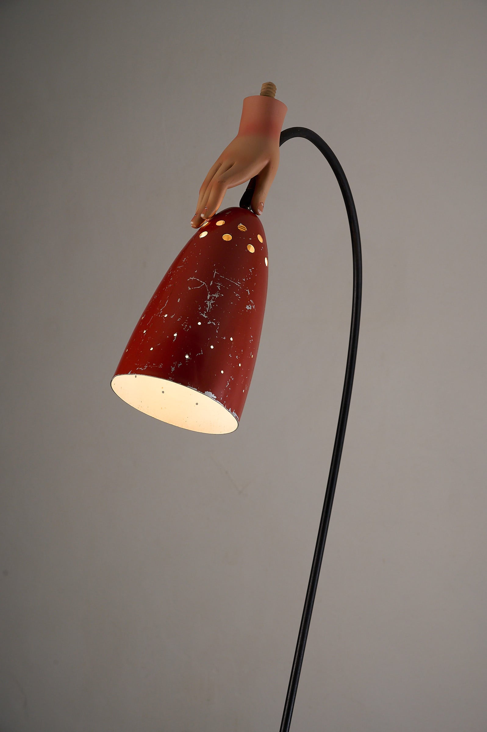 'Grasshopper' Floor Lamp, The Netherlands, 1950s featuring a red lacquer shade and a unique hand design.