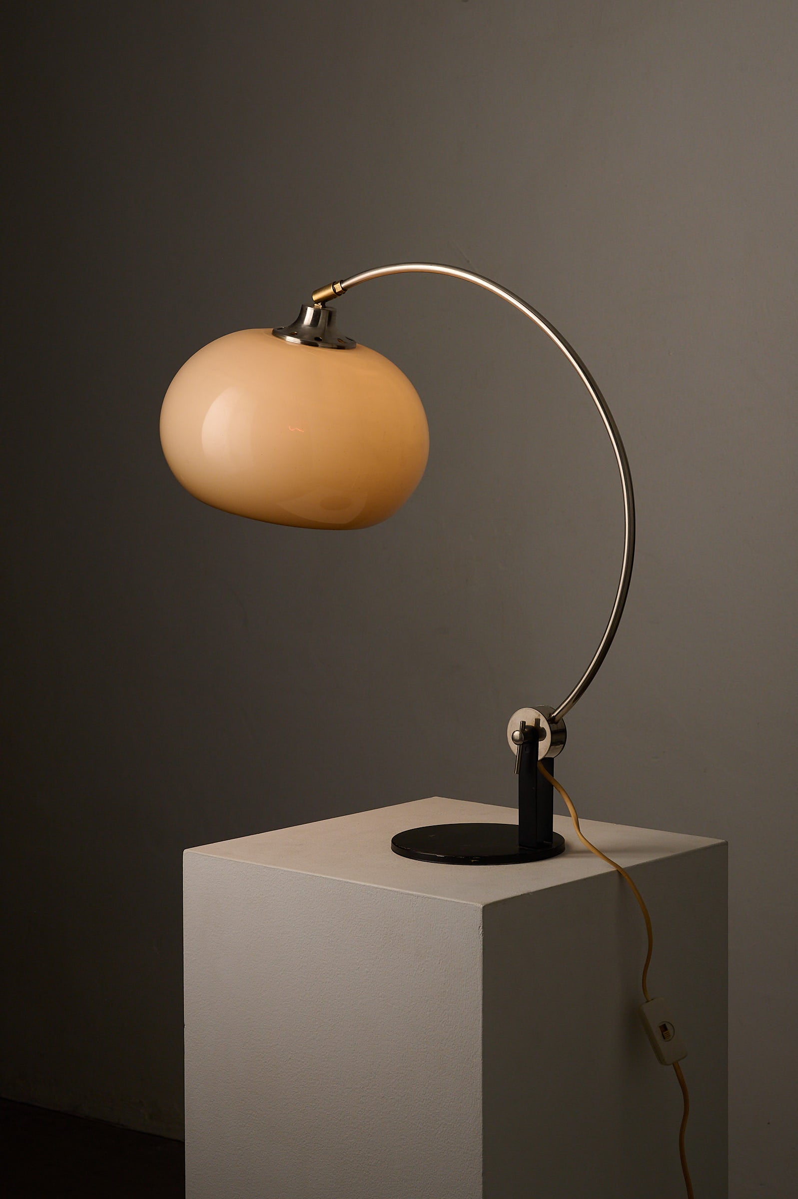 Chrome Arc Desk Lamp by Cosack Leuchten, Germany, 1970s on display with warm acrylic shade and sleek metal finish.