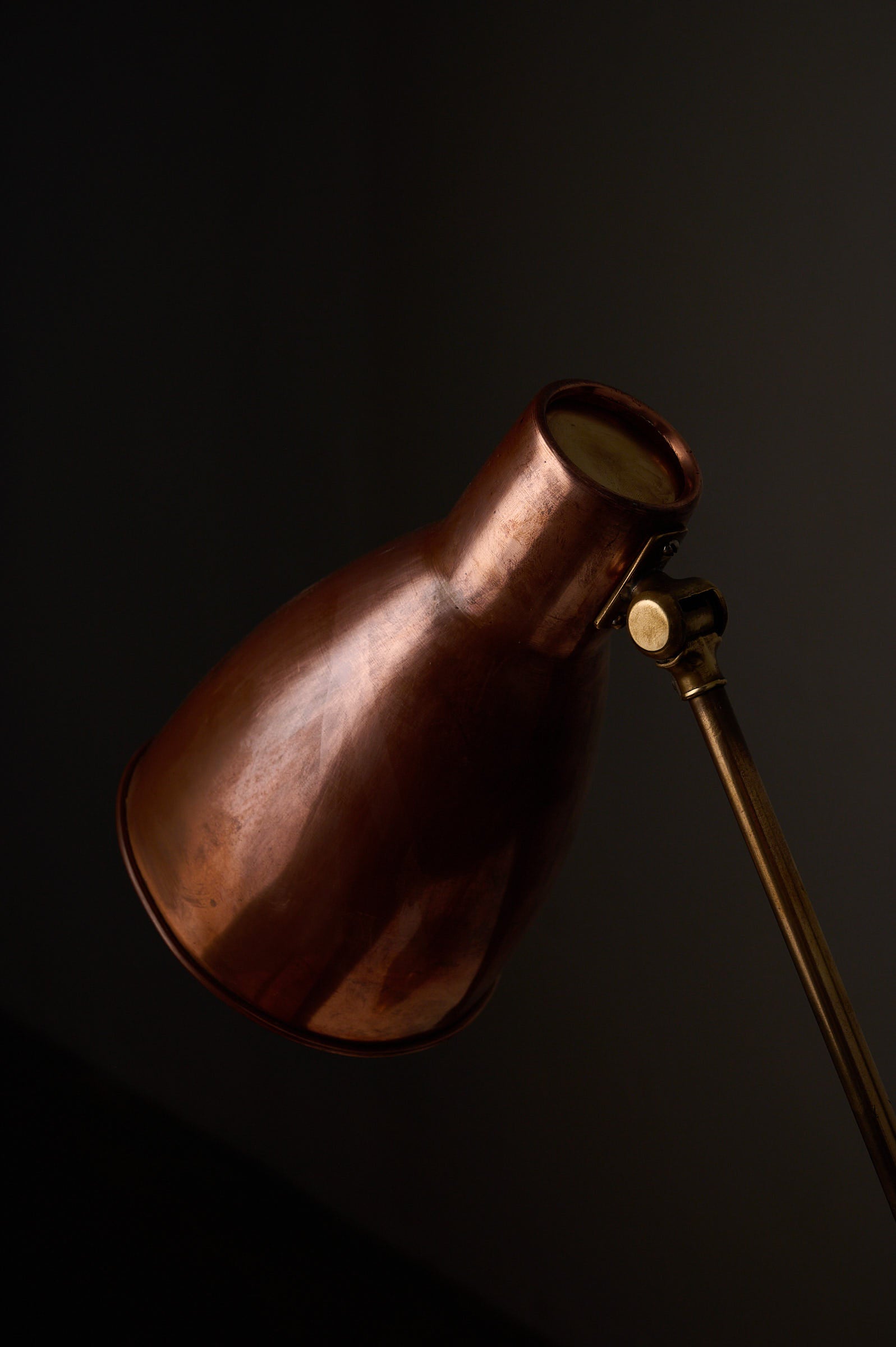 Mid-Century Modern Copper & Brass Desk Lamp, Europe, 1950s with a copper cone shade and brass arm.