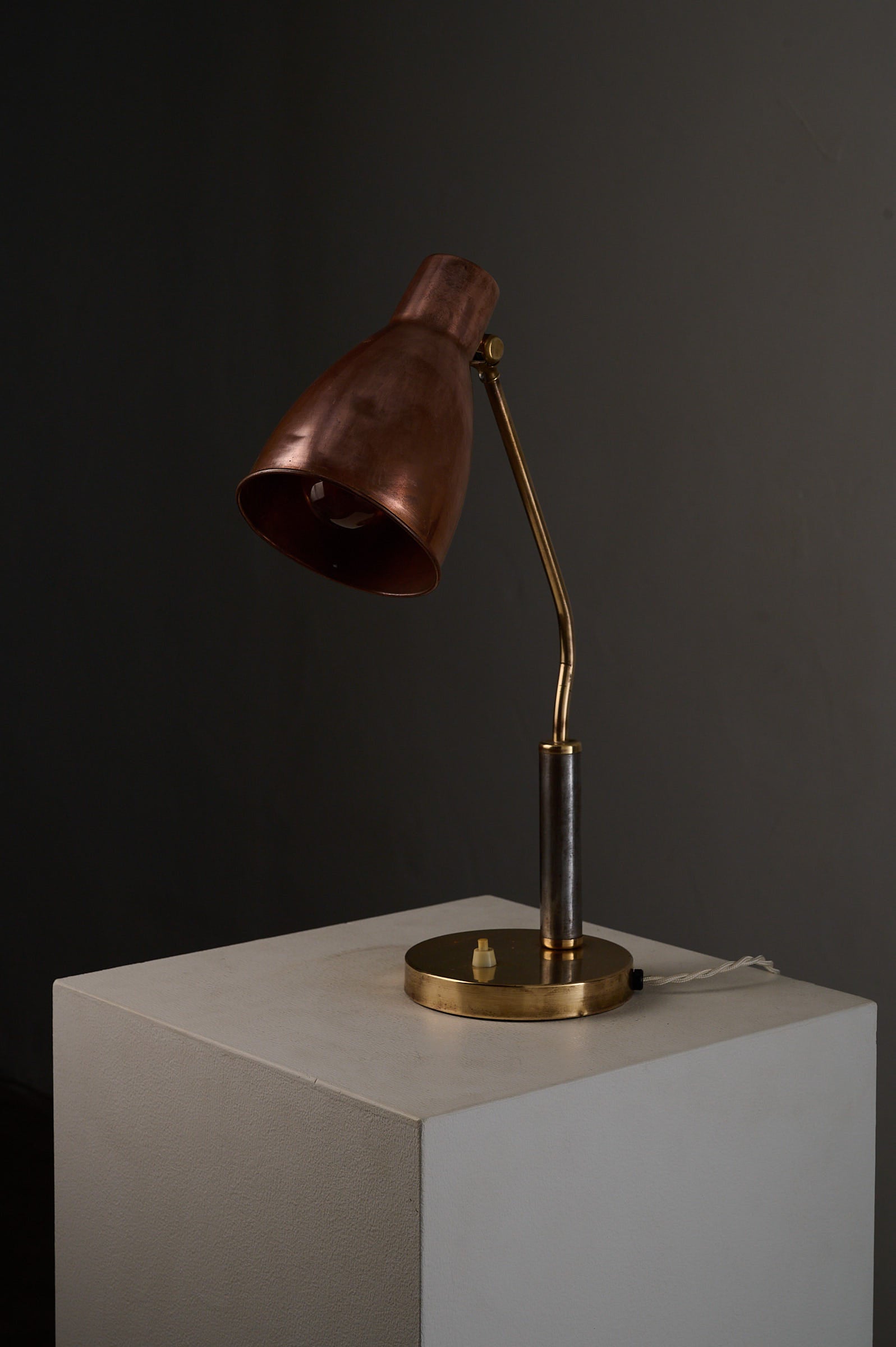 Mid-Century Modern Copper & Brass Desk Lamp, Europe, 1950s on a white pedestal with a sleek design.