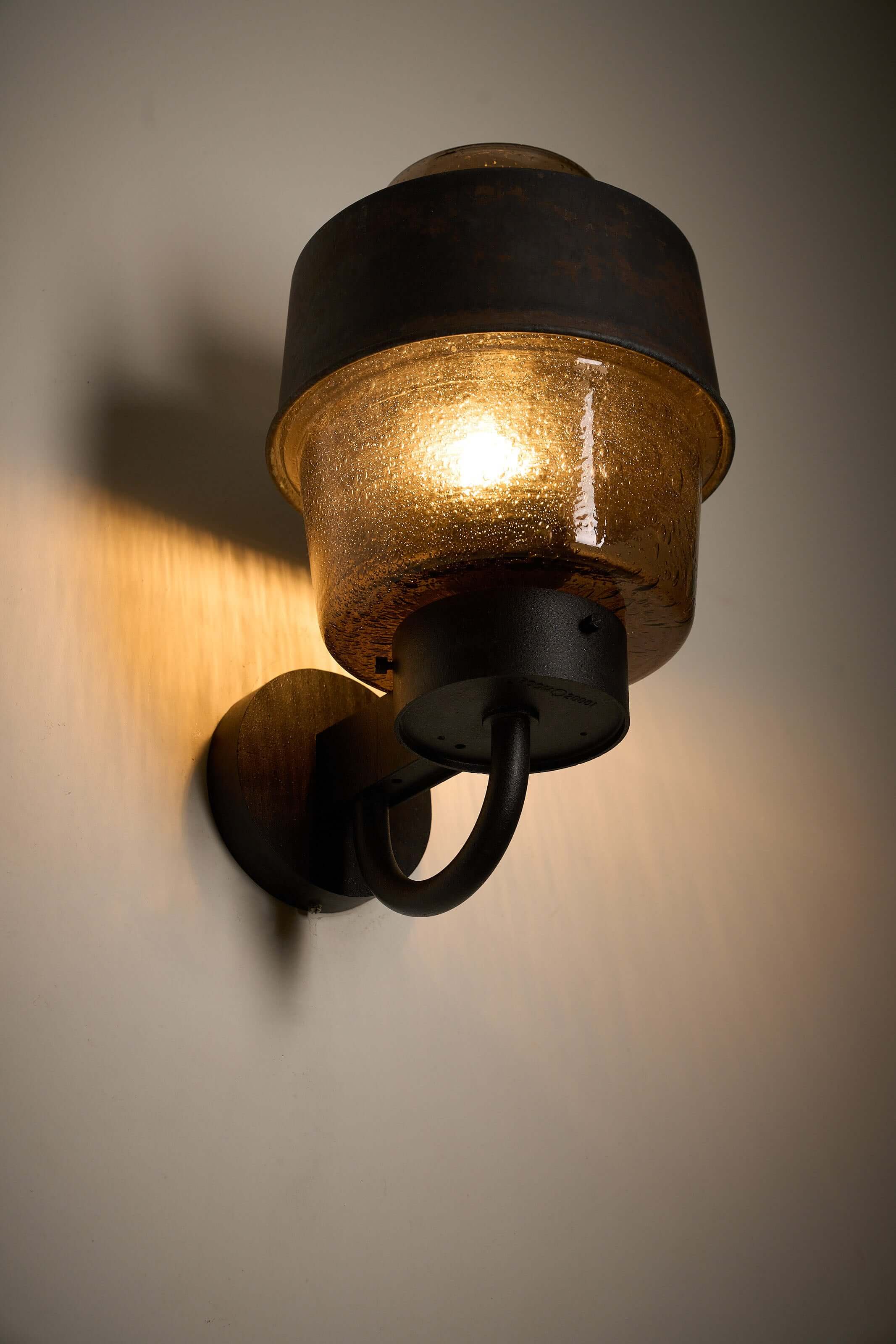 Outdoor Lantern with Amber Bubble Glass by Boom Bega mounted on a wall, featuring cast aluminum and amber glass.