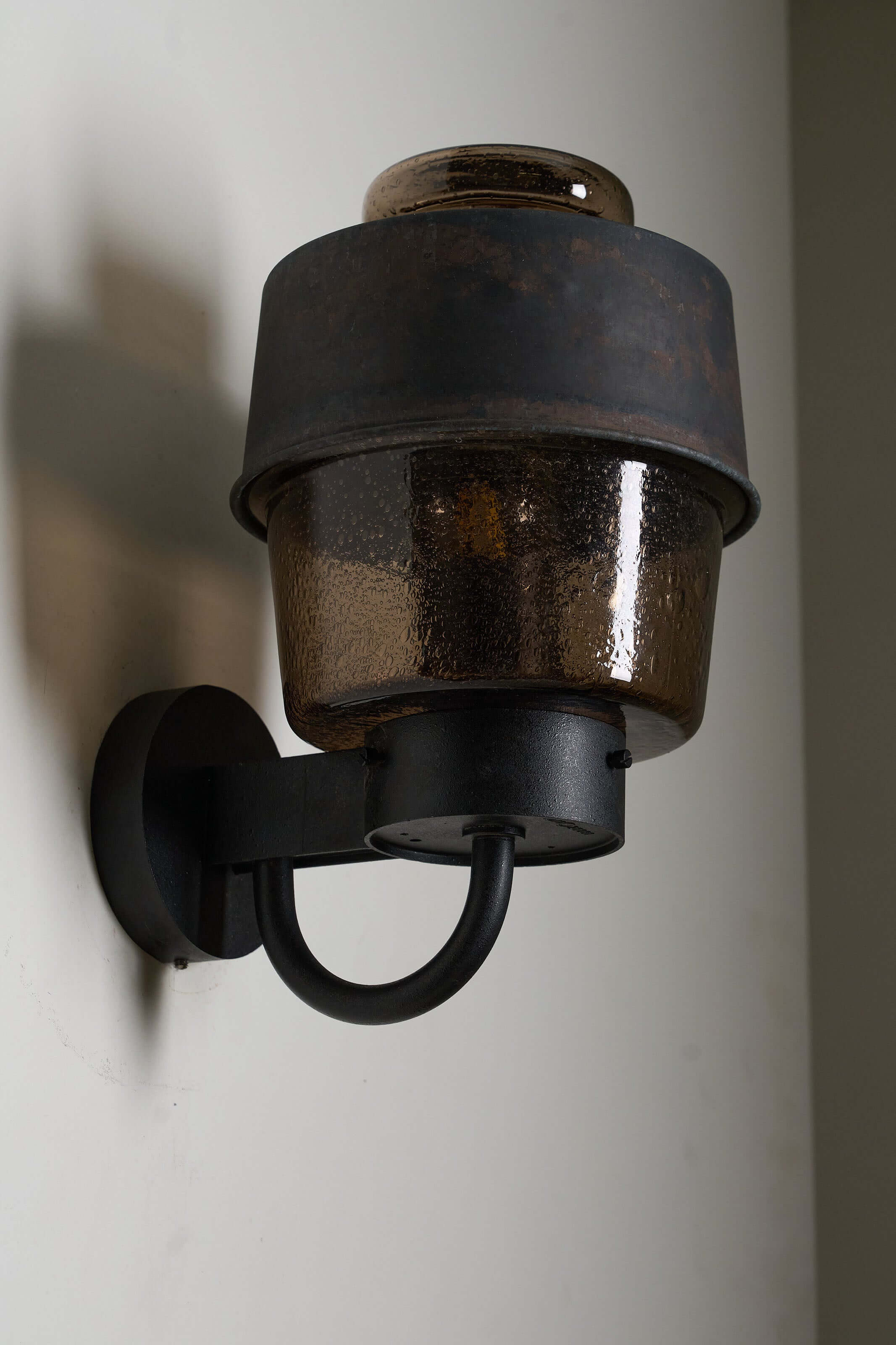 Outdoor Lantern with Amber Bubble Glass by Boom Bega mounted on wall, featuring amber bubble glass and cast aluminum.