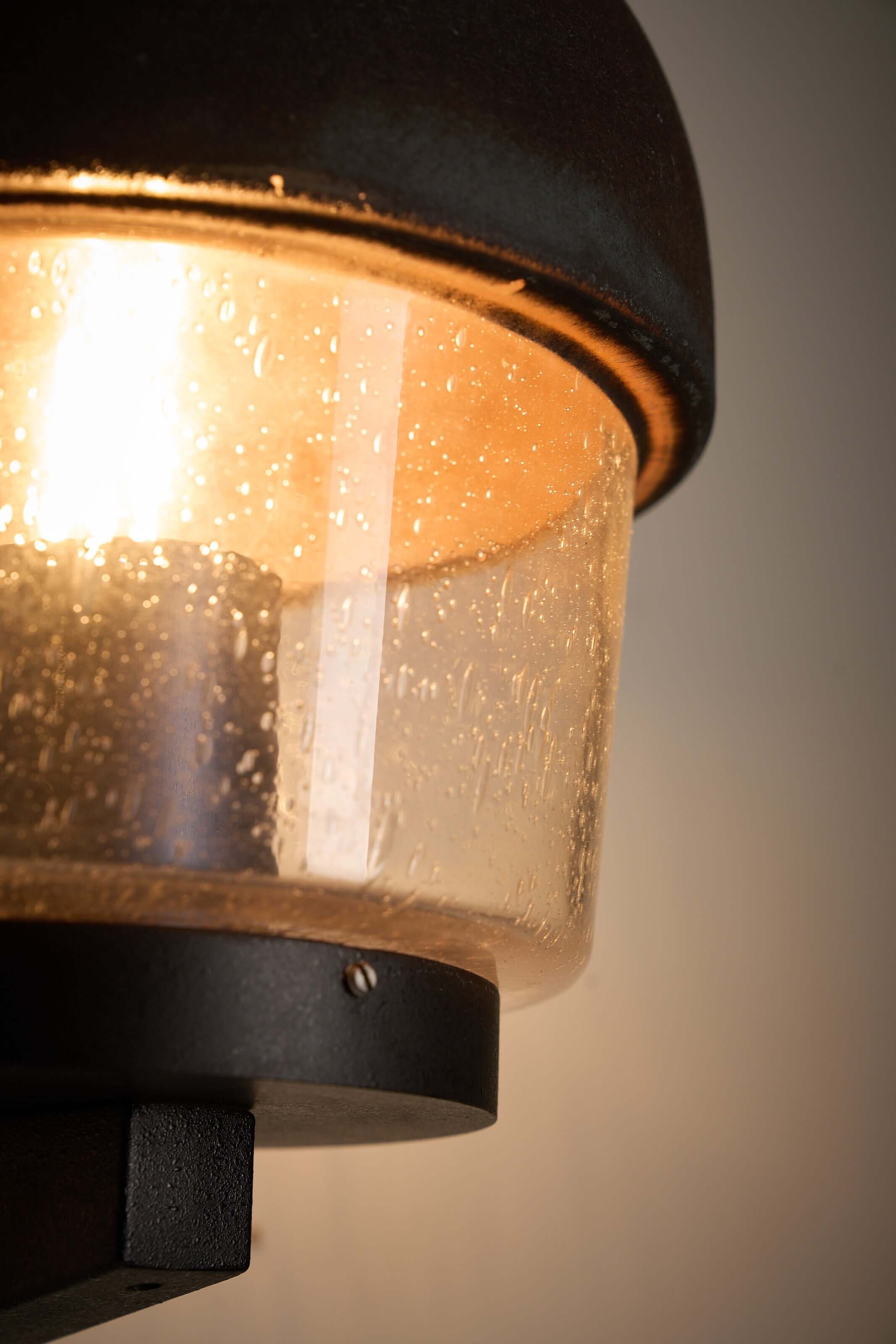 'Boom' Wall Lamp with Fused Copper Alloy on Glass showcasing its elegant design and warm ambient glow.