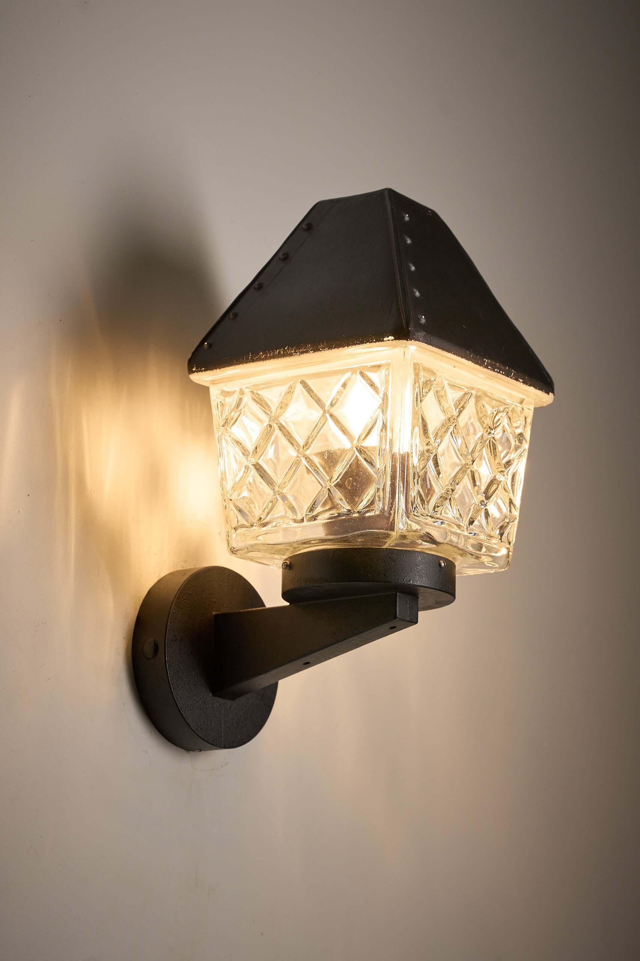 Outdoor Lantern Wall Lamp by Boom Bega with geometric glass diffuser and cast aluminium bracket.