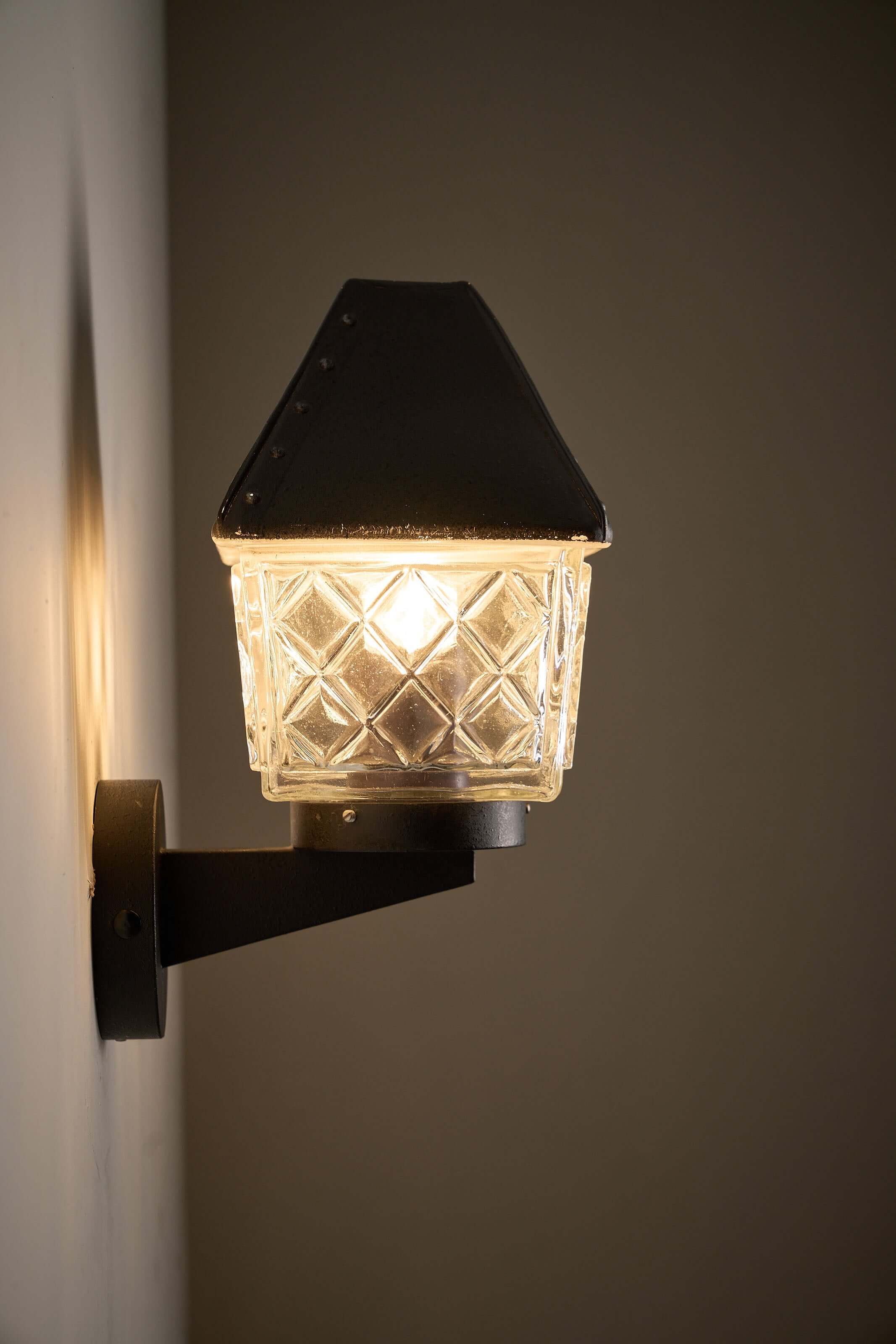 Outdoor Lantern Wall Lamp by Boom Bega with diamond pattern glass diffuser and cast aluminum housing.