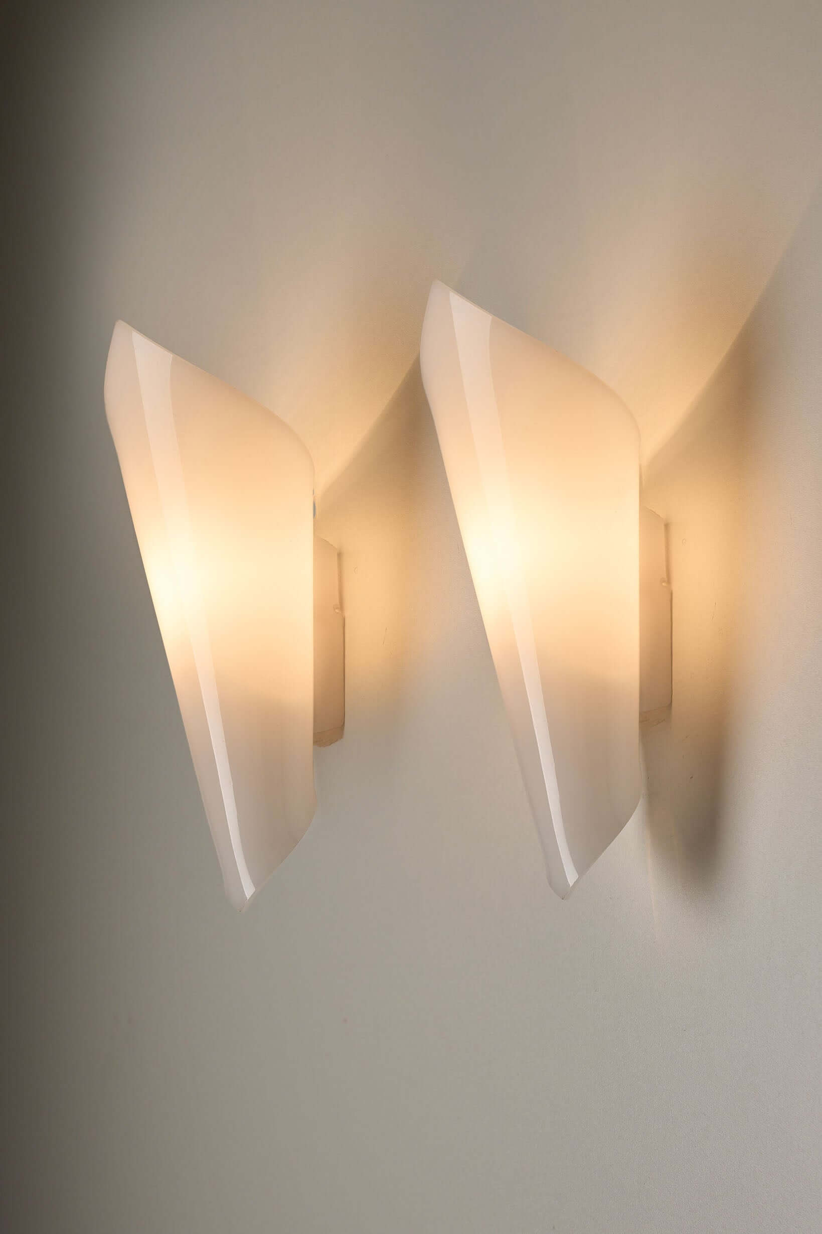Set of Open Cone Wall Lamps in White Plexiglas by Hanns Hoffmann-Lederer, Germany, 1950s showcasing soft, warm light.