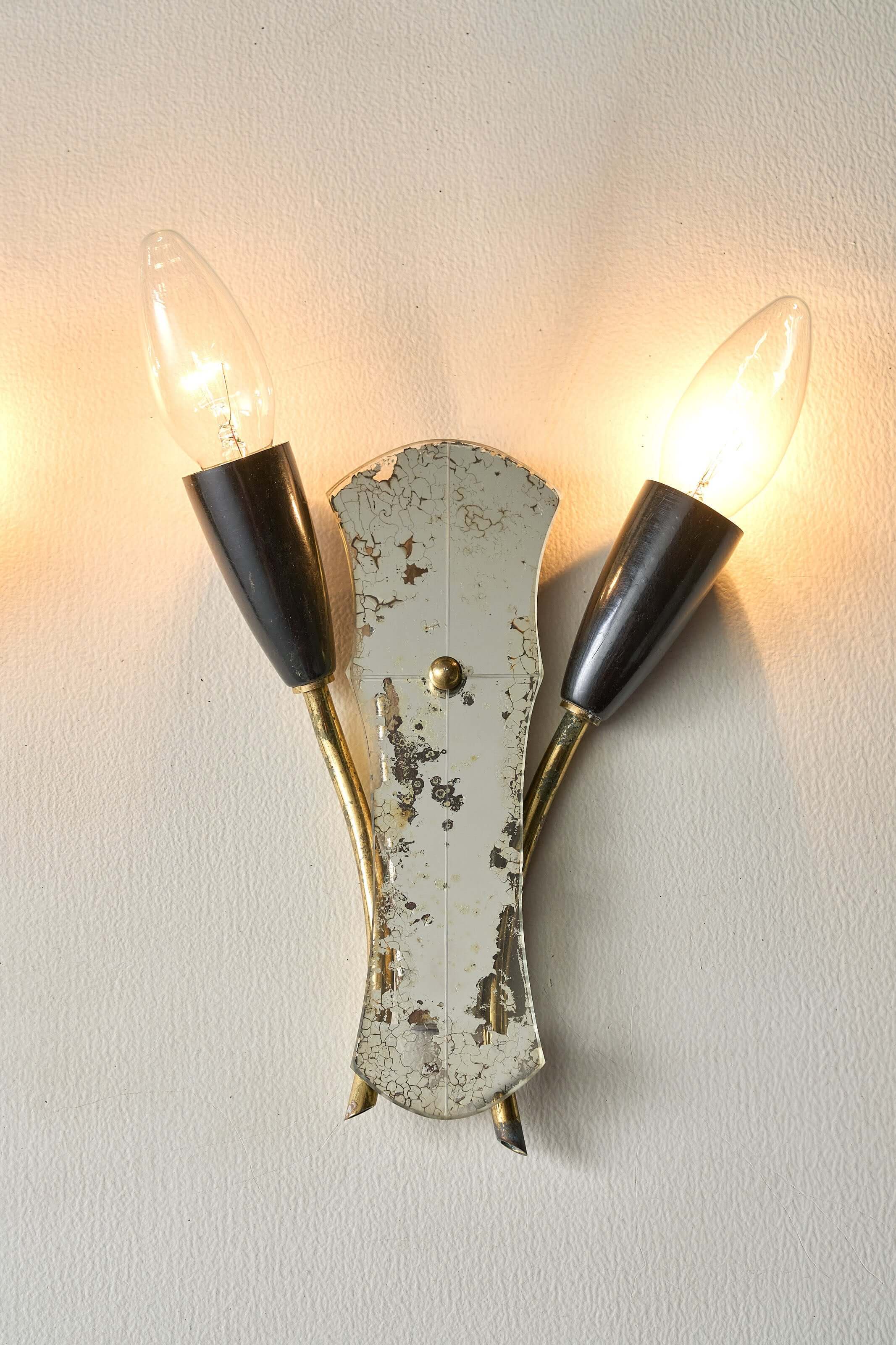 Brass and Mirrored Glass Wall Lamp, 1950s design featuring curved brass tubes and mirrored glass, vintage lighting fixture.