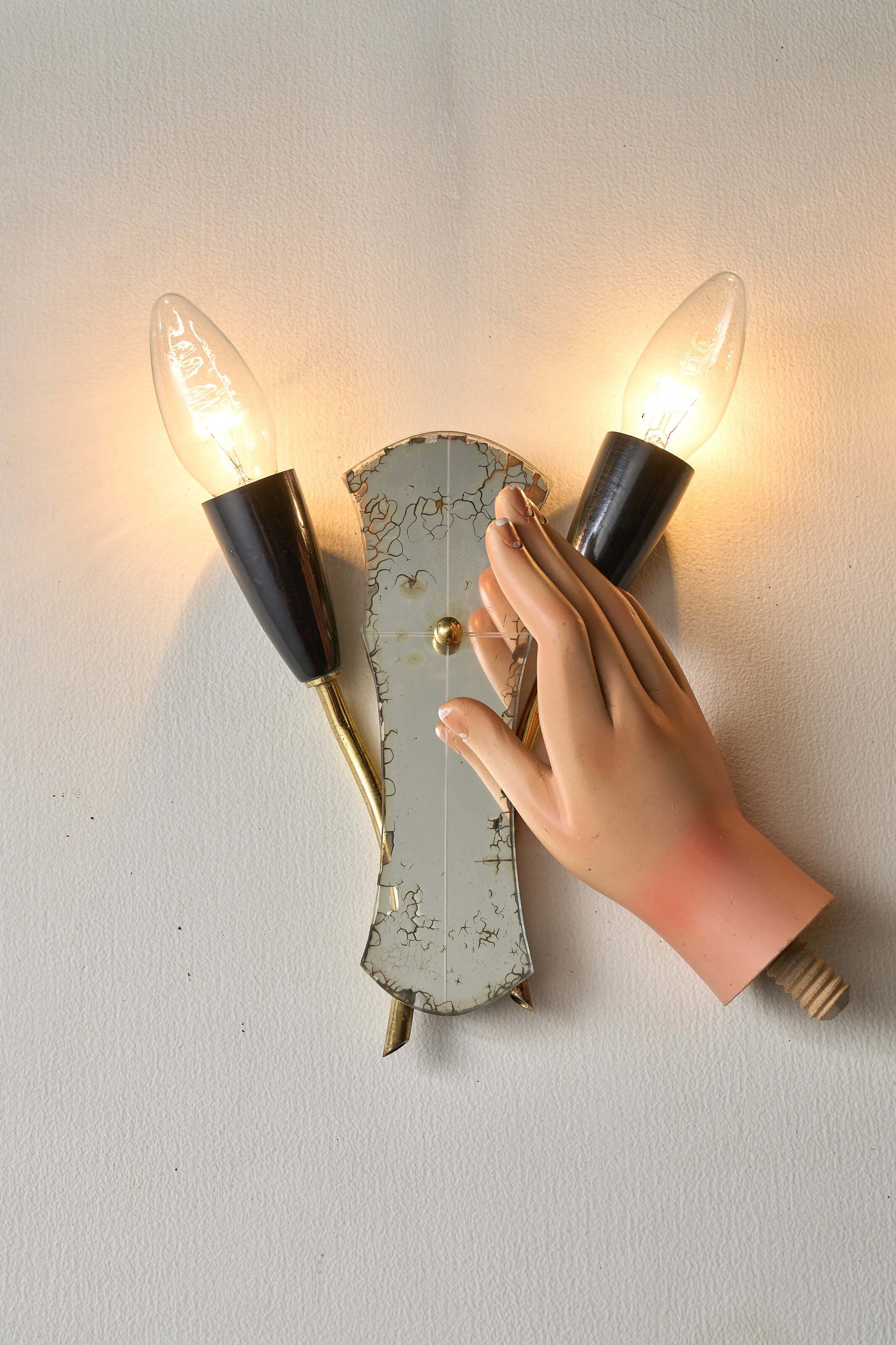Brass and Mirrored Glass Wall Lamp, 1950s with unique hand design and two lights on a vintage wall mount.