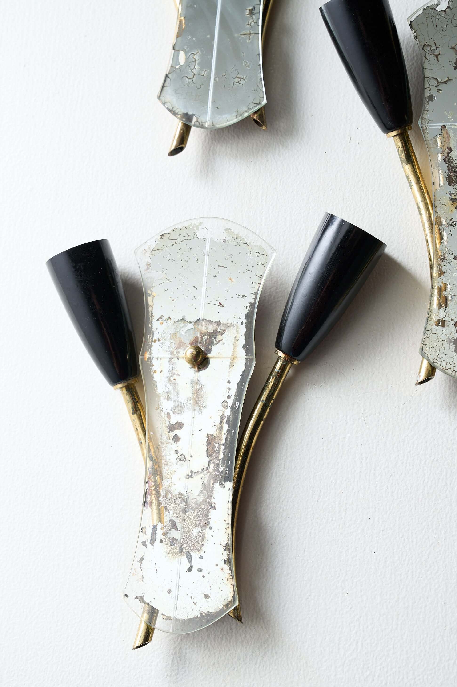 Brass and Mirrored Glass Wall Lamp, 1950s with two black lampholders and asymmetrical design.
