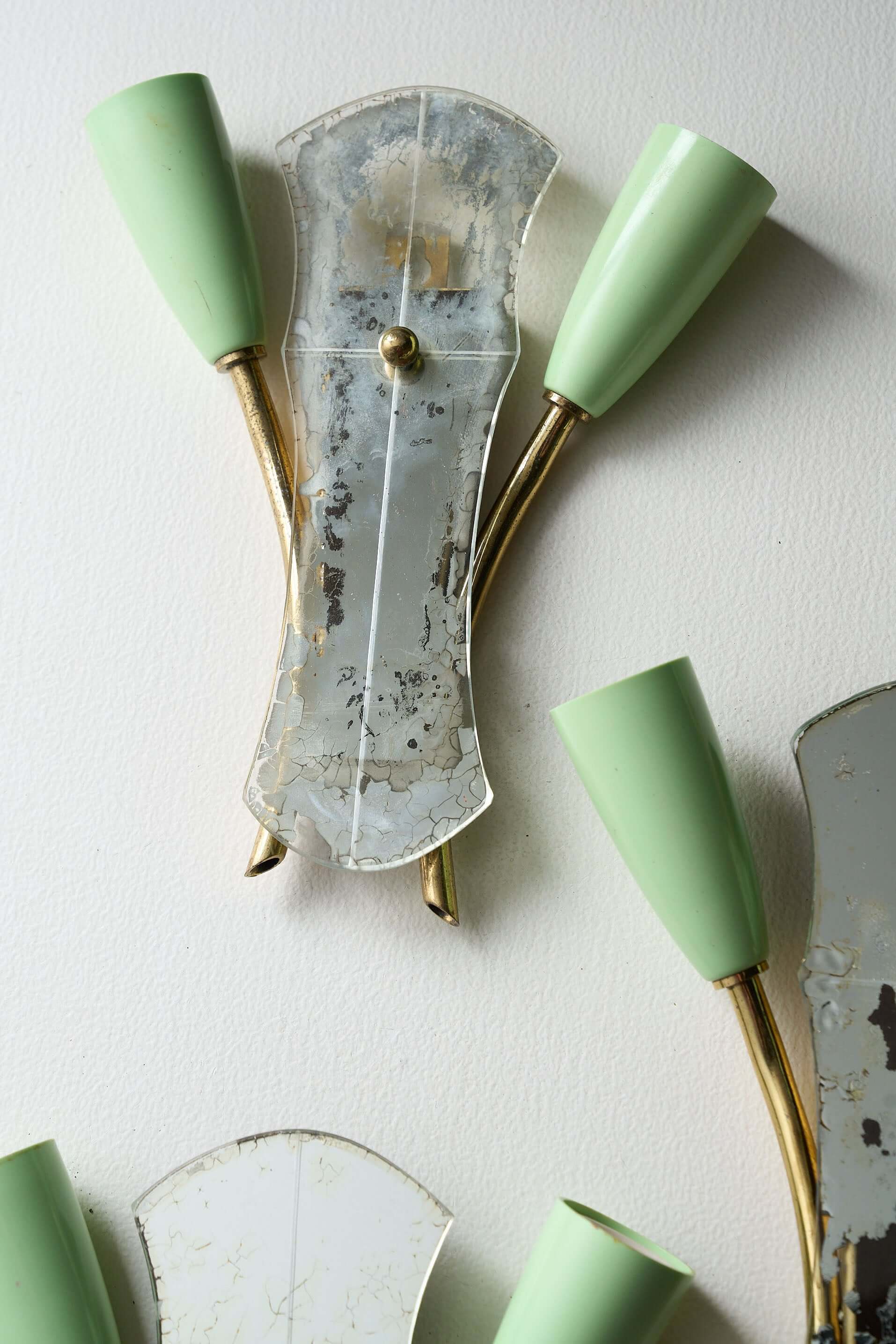 Brass and Mirrored Glass Wall Lamp, 1950s featuring curved brass tubes and green cone-shaped lampholders.