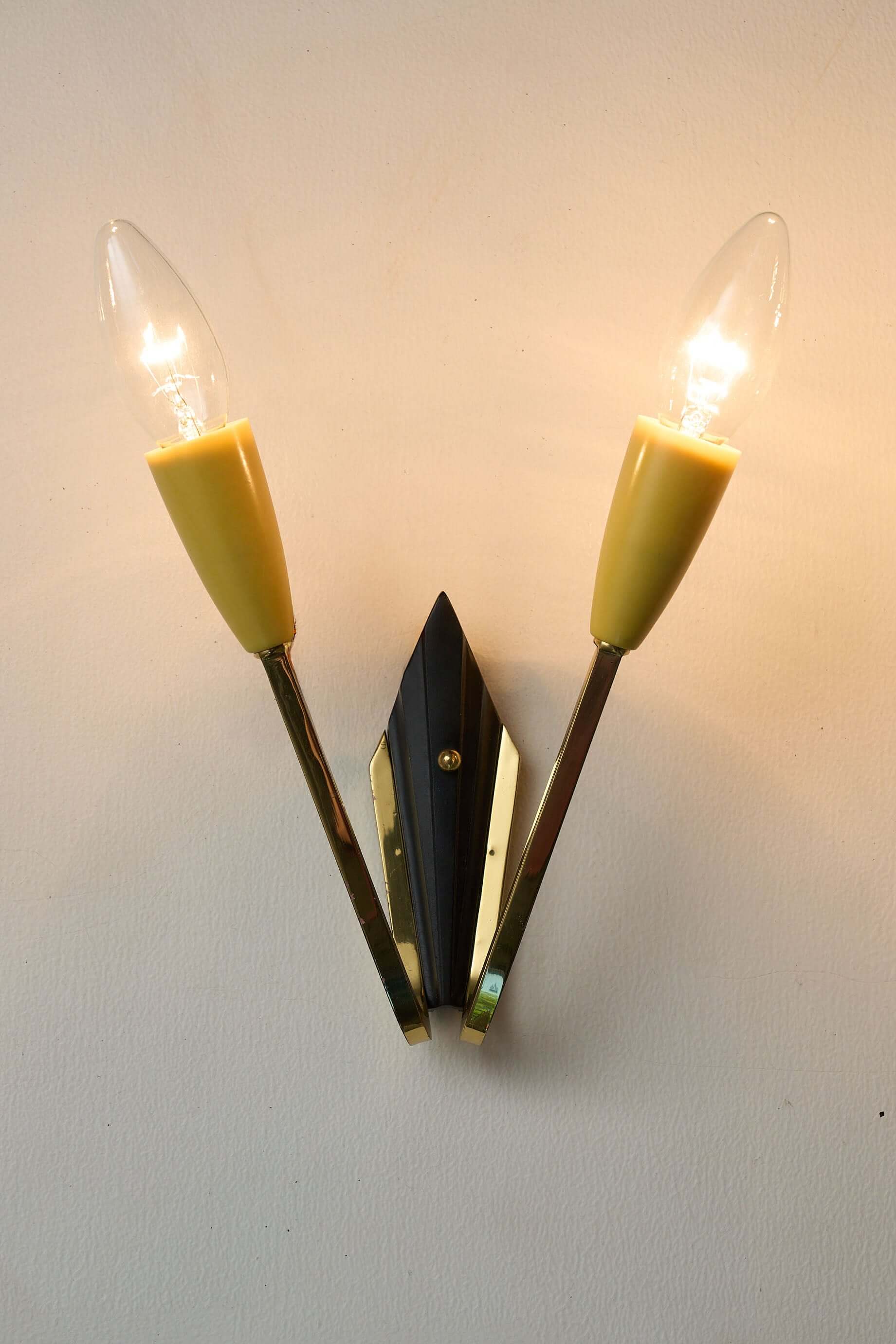 Geometric Brass and Black Wall Lamp, 1950s with two yellow cone-shaped light sockets.