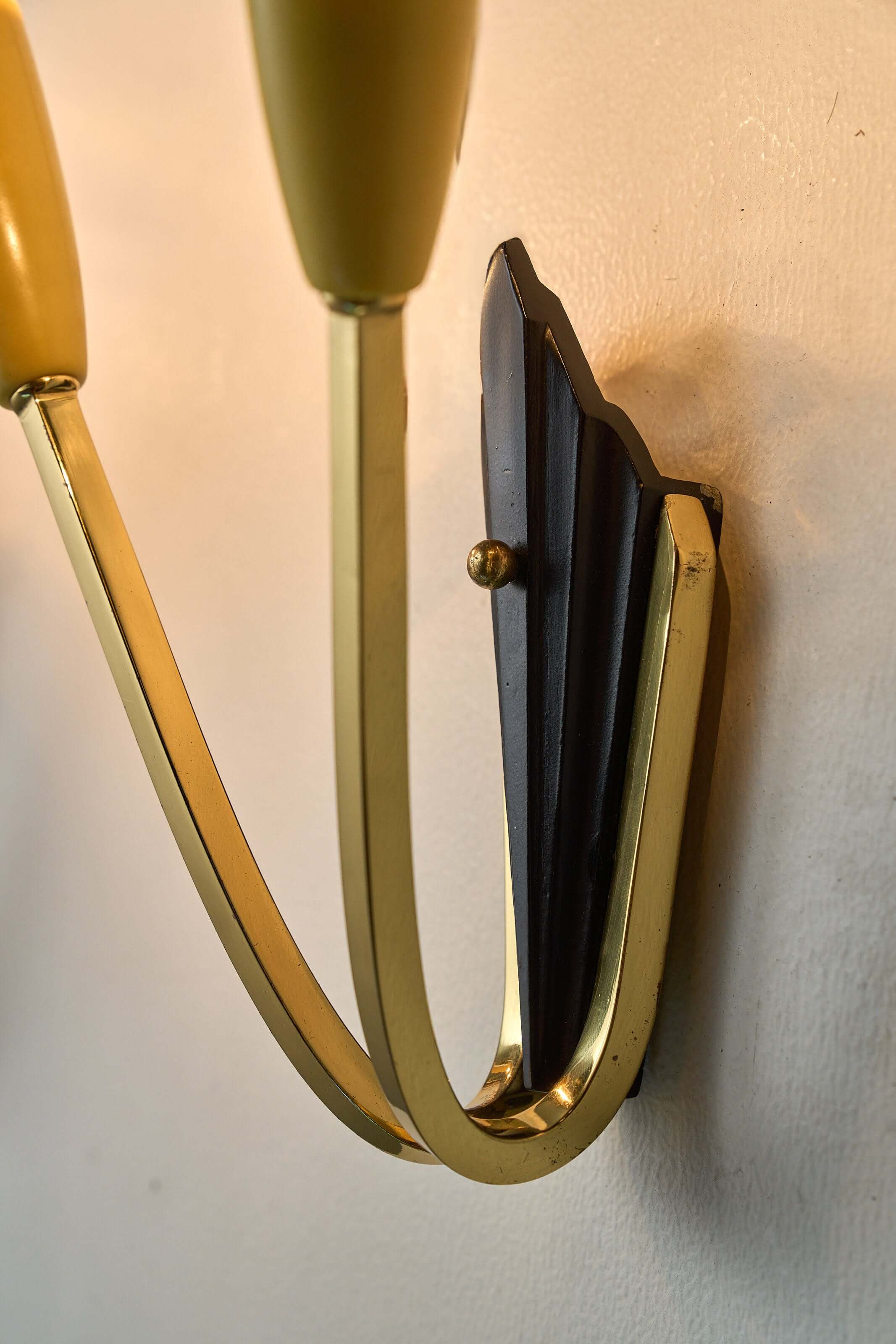 Geometric Brass and Black Wall Lamp, 1950s close-up of the black base and brass arms.