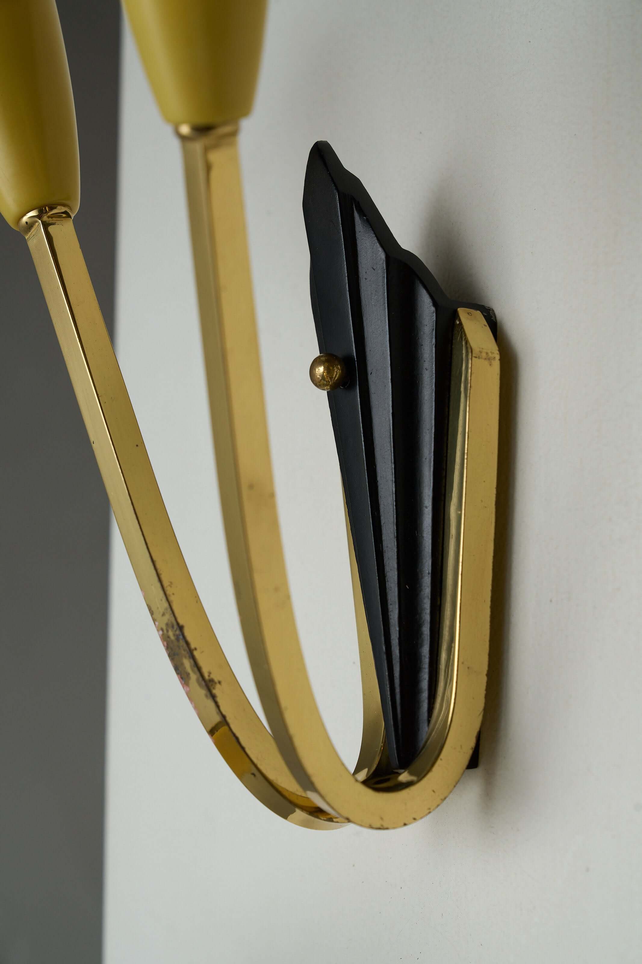 Geometric Brass and Black Wall Lamp, 1950s close-up showing brass arms and black base detail.