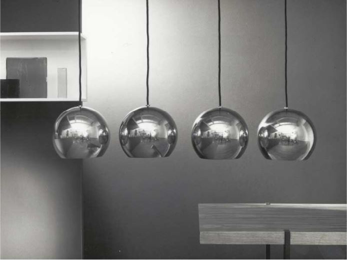 Chrome Sphere Pendant lighting featuring four sleek chrome spheres hanging elegantly.