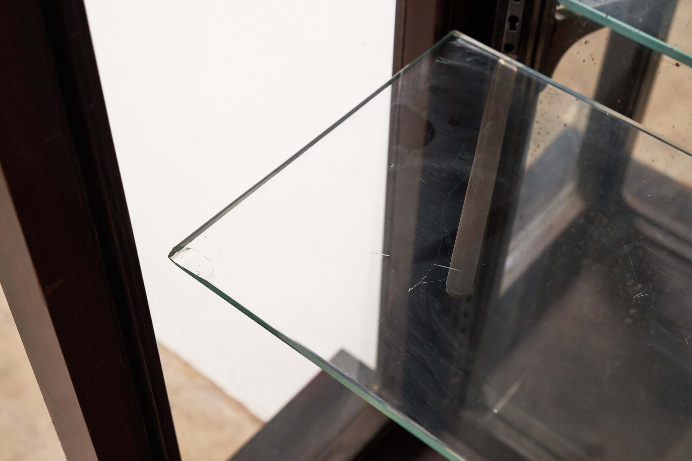 Art Deco Mirrored Display Cabinet with Sliding Doors featuring a glass shelf and elegant structure.