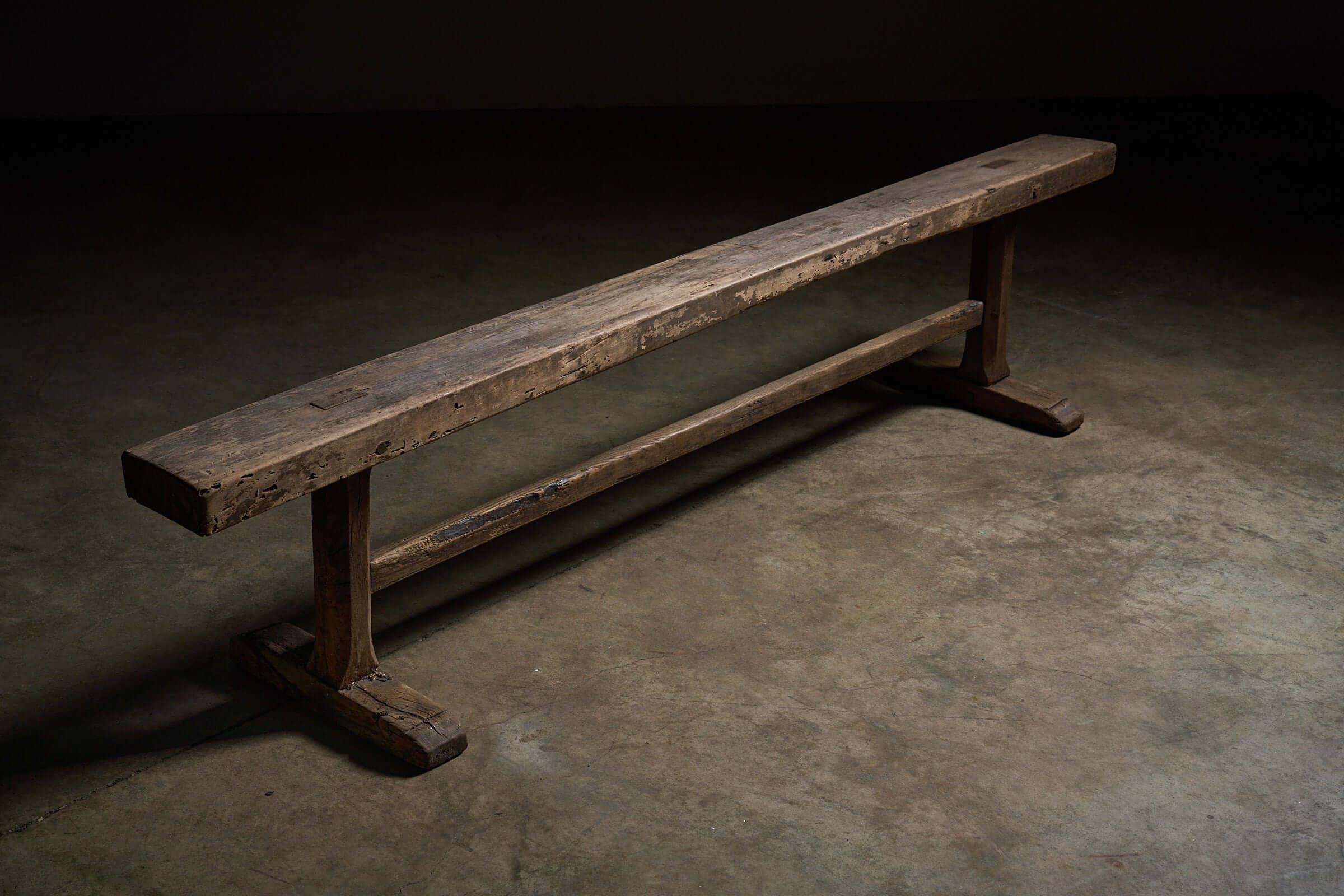 Spanish Trestle Bench in Solid Wood featuring rustic design and sturdy T-shaped trestle legs with a weathered finish.
