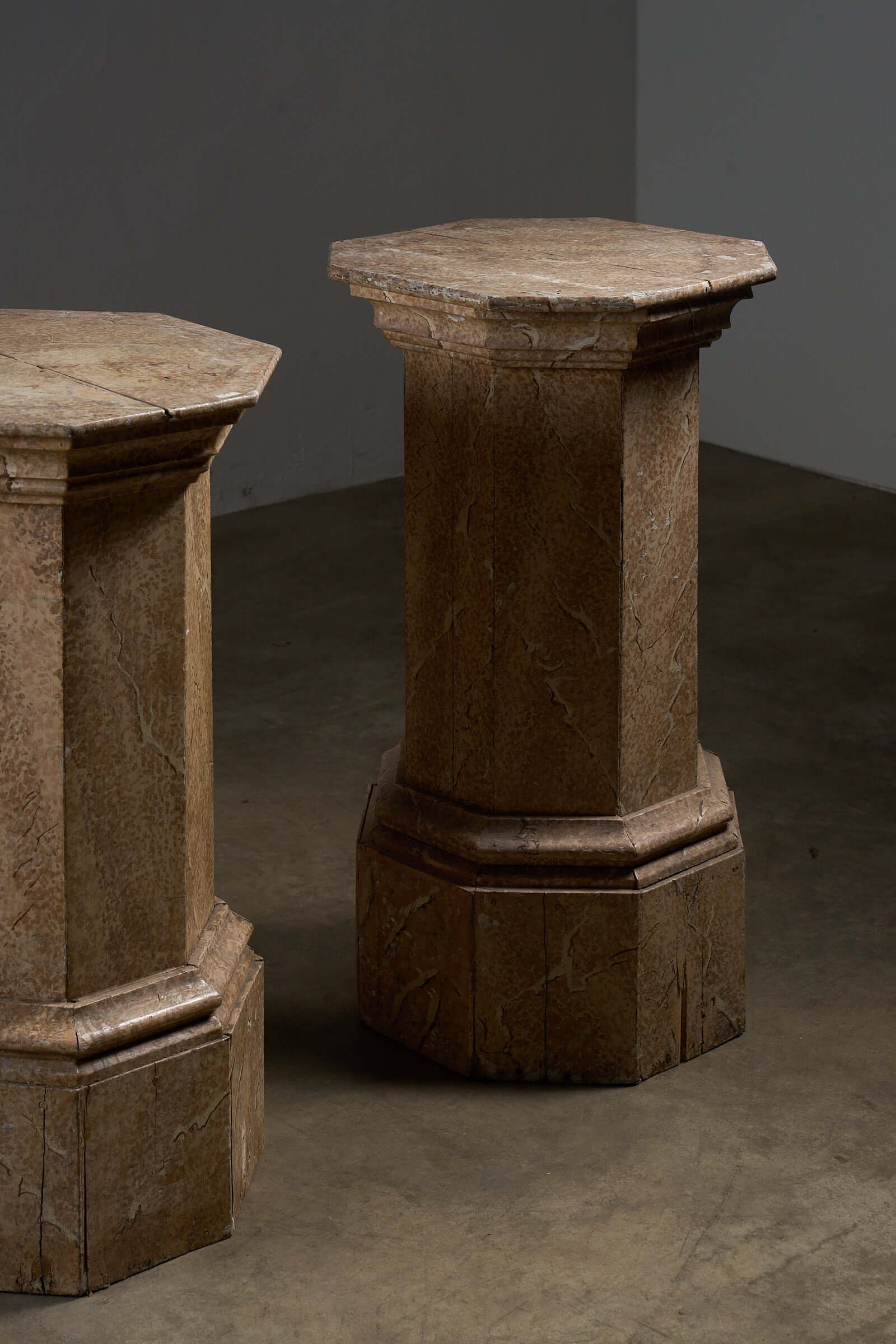 Pair of Antique Faux Marble Octagonal Pedestals showcasing a hand-painted faux marbre finish.