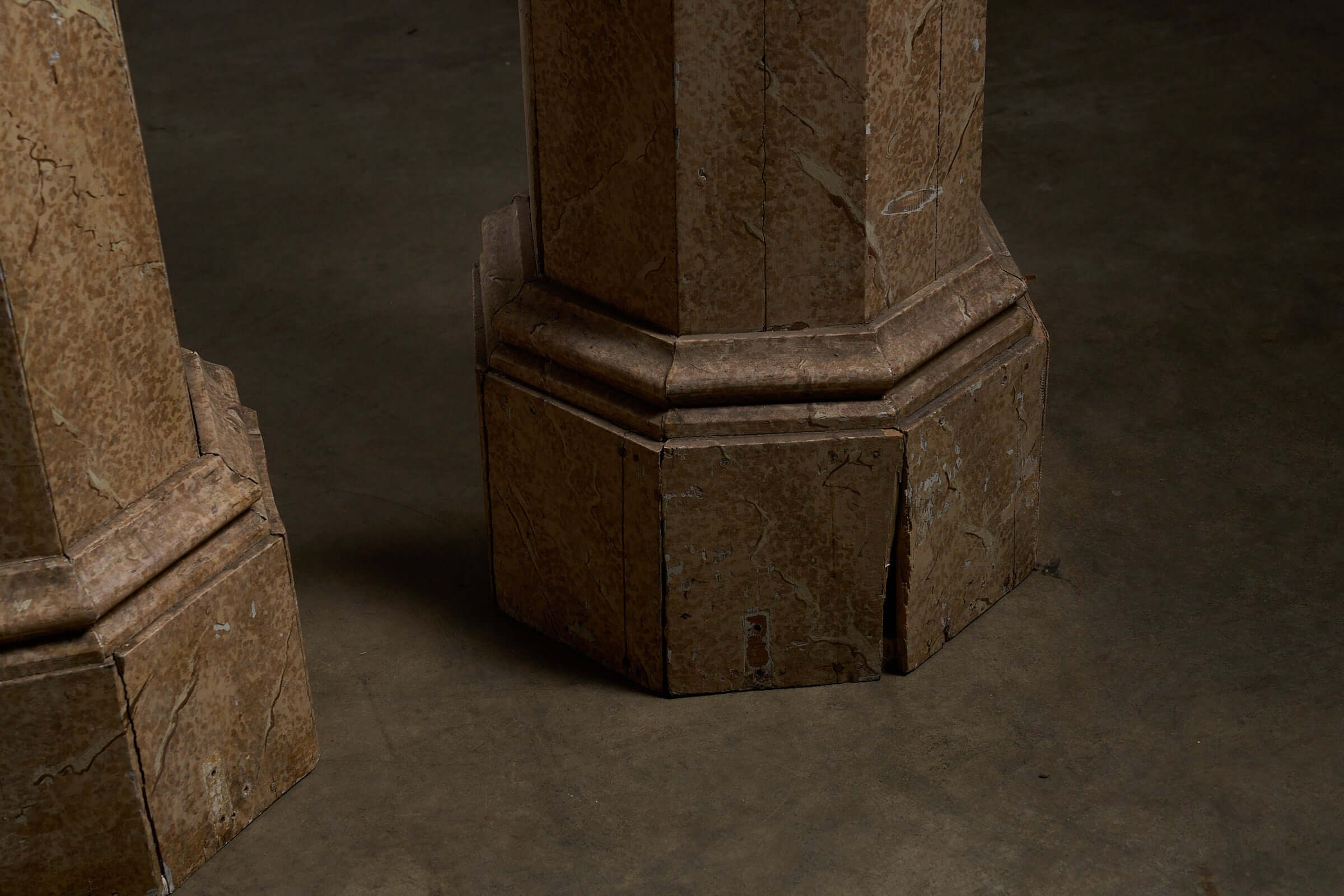 Pair of Antique Faux Marble Octagonal Pedestals showcased from the base, highlighting their unique faux marbre finish.