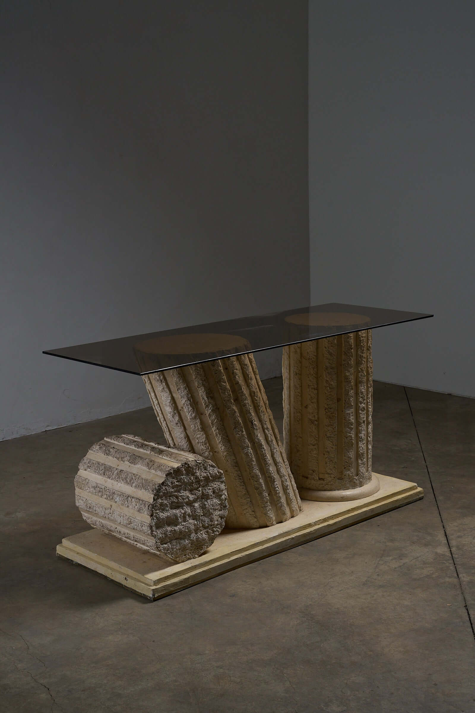 Postmodern 'Greek Ruins' Console Table in Mactan Stone 1980s featuring fluted columns and a glass top.