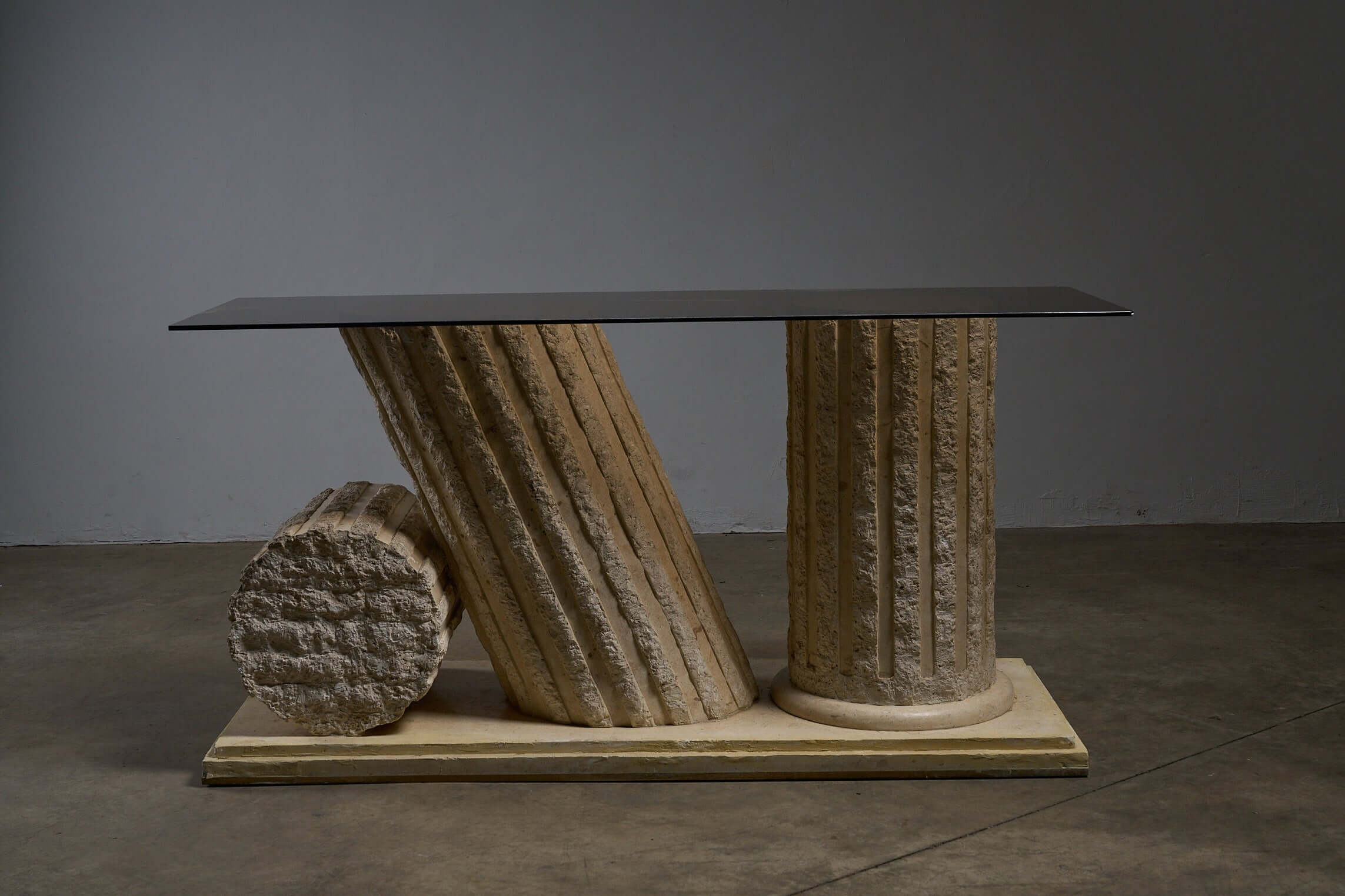Postmodern 'Greek Ruins' Console Table in Mactan Stone 1980s featuring fluted columns and stepped stone plinth.