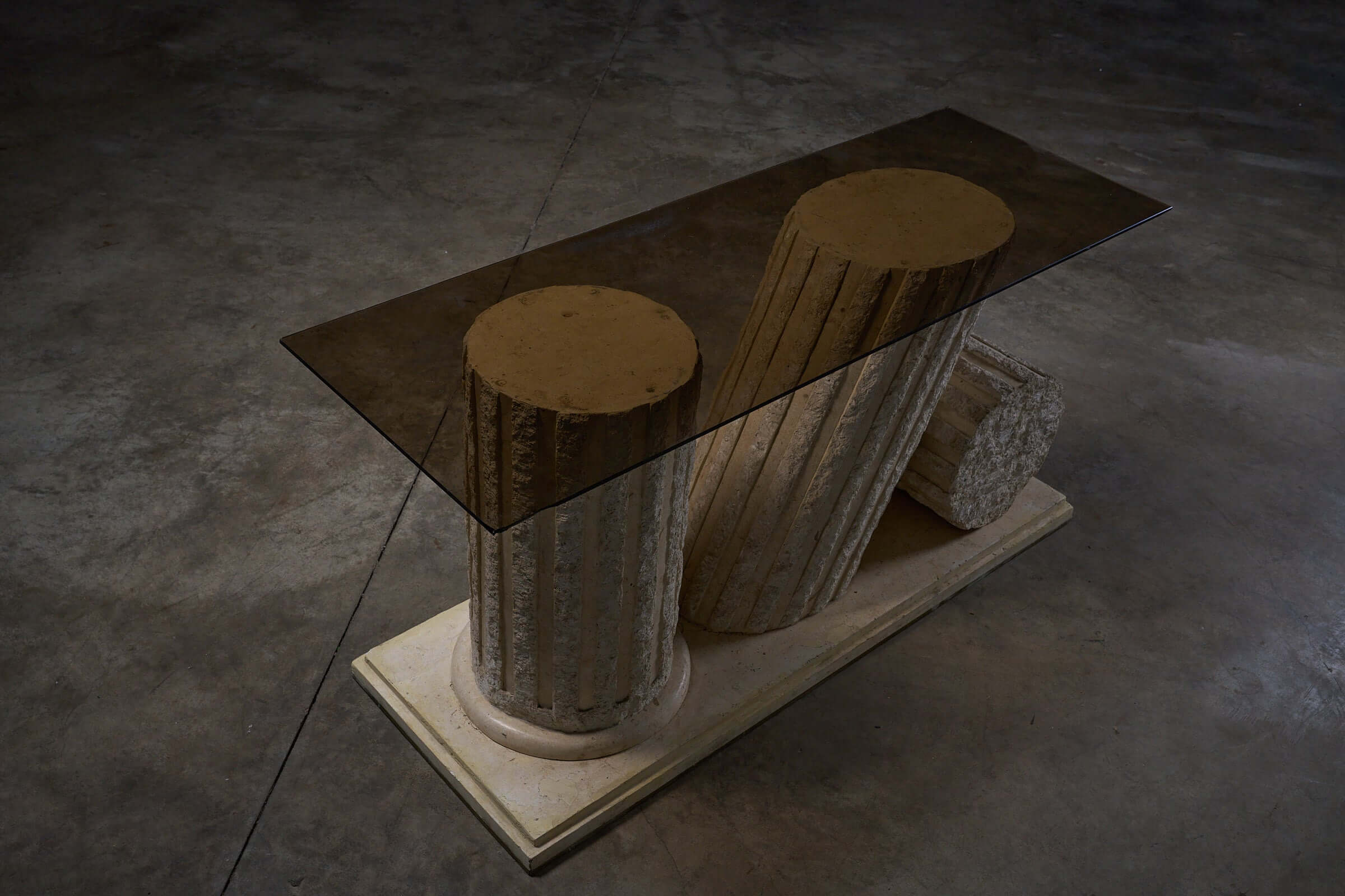 Postmodern 'Greek Ruins' Console Table in Mactan Stone 1980s with fluted columns and glass top.