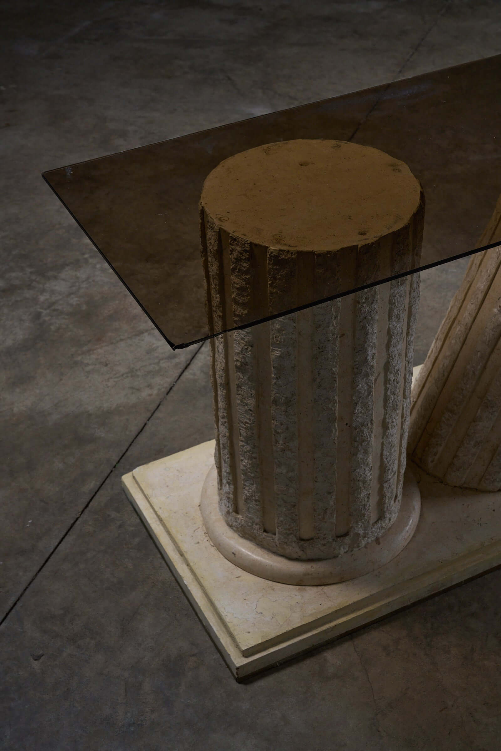 Postmodern 'Greek Ruins' Console Table in Mactan Stone 1980s with fluted column base and glass top.