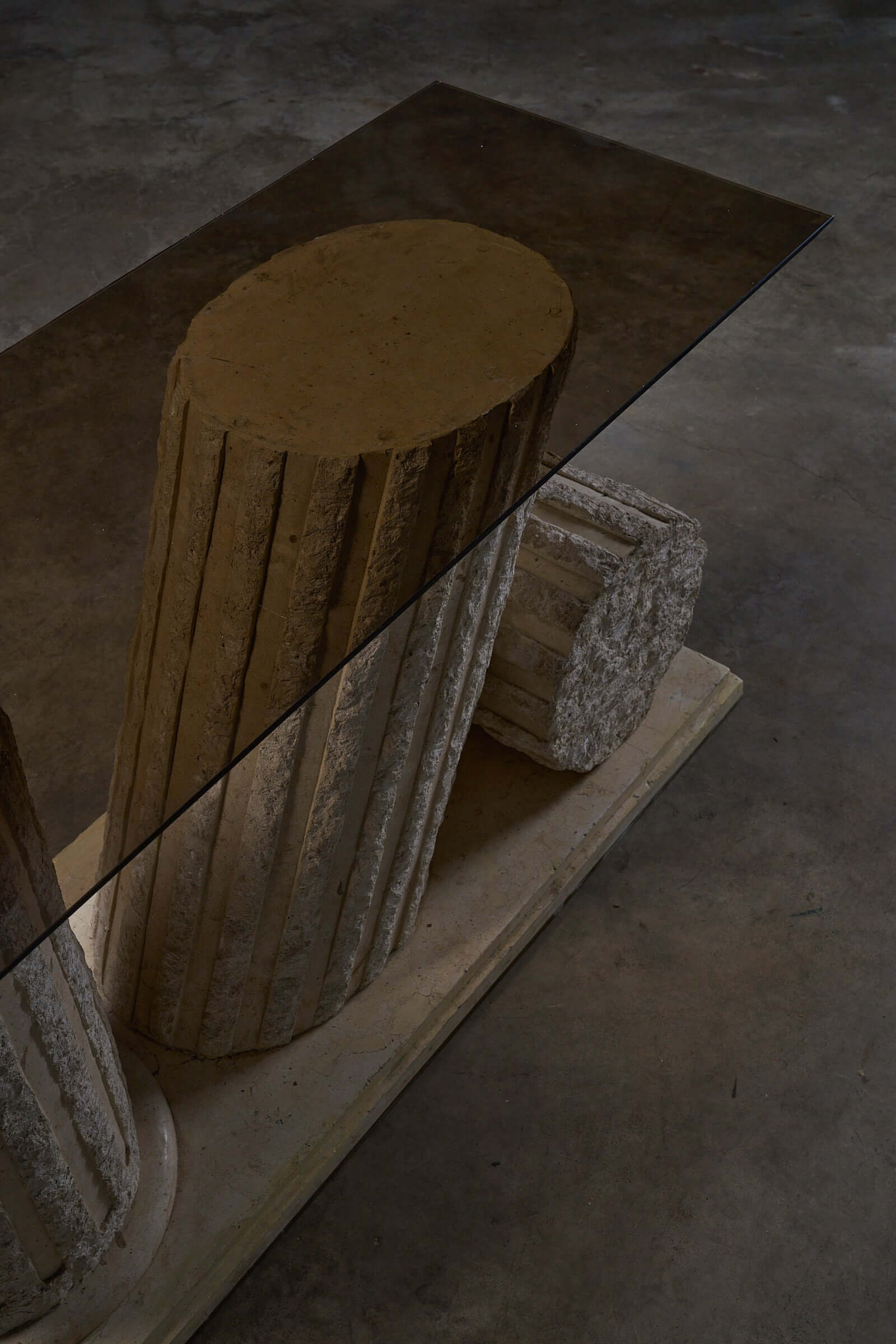 Postmodern 'Greek Ruins' Console Table in Mactan Stone 1980s with fluted columns and glass top.