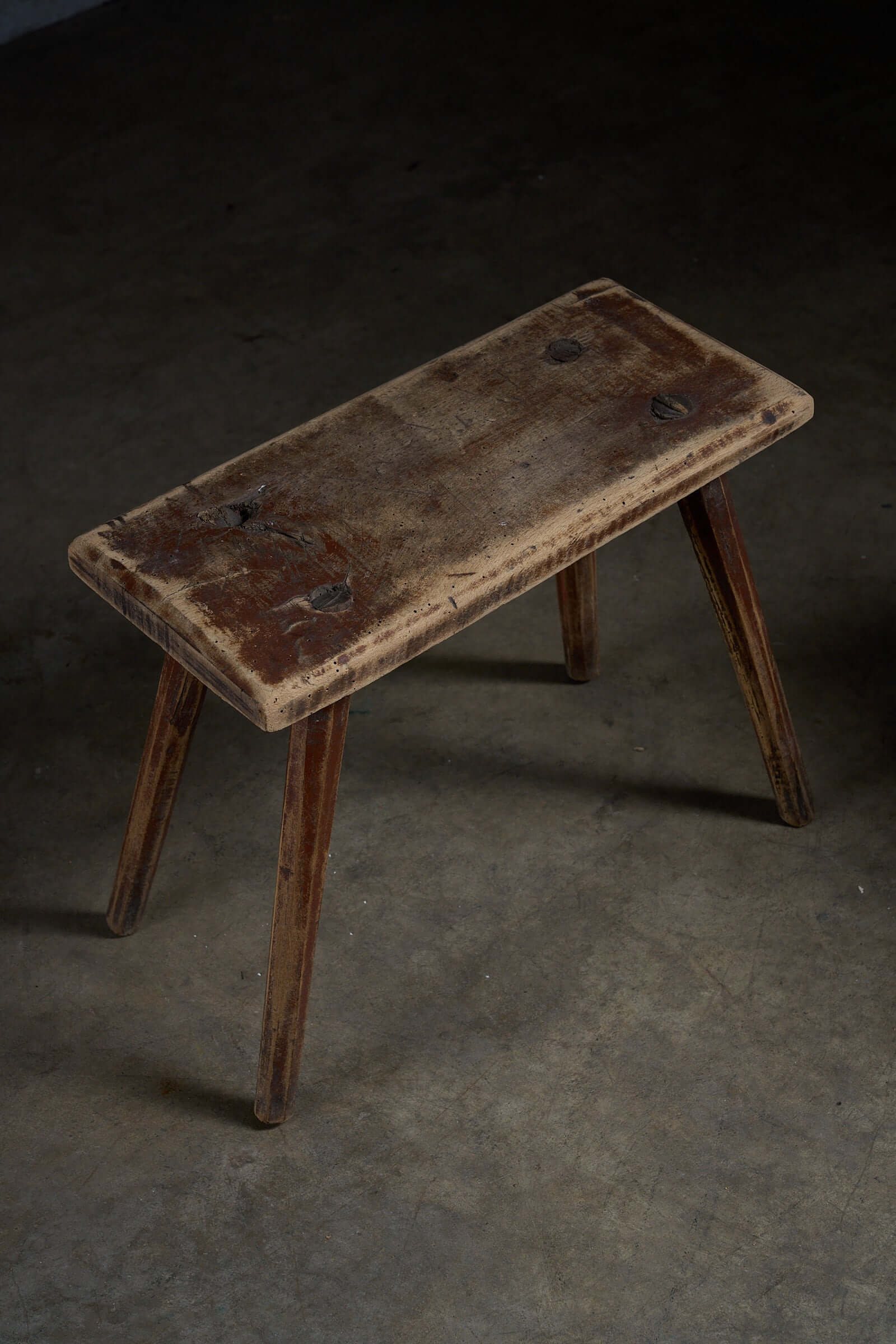 Antique Wooden Stools with textured wood, showcasing deep grain and worn edges, ideal as low side tables.