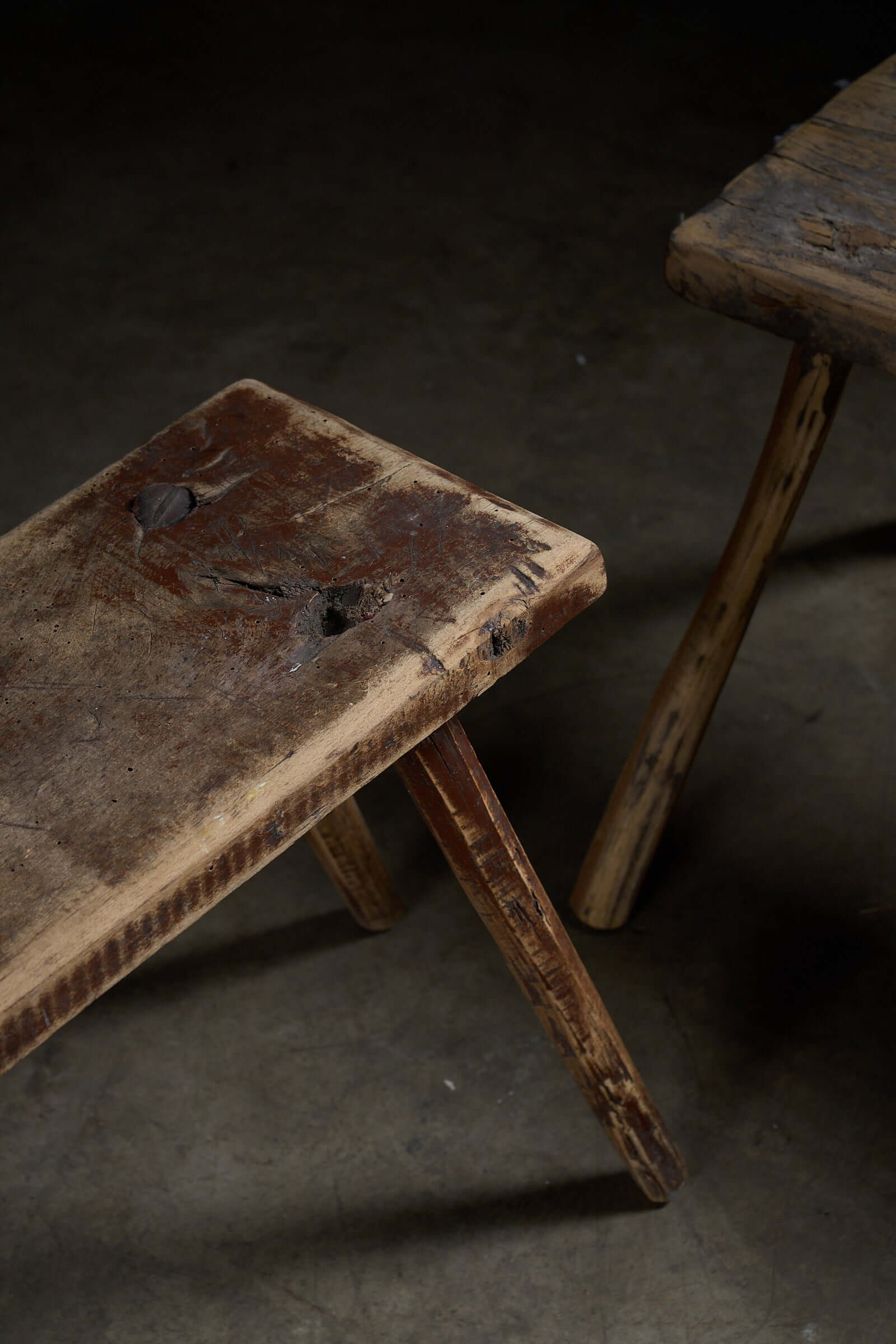Antique Wooden Stools with textured surfaces and unique historical marks, perfect as low tables or plant stands.
