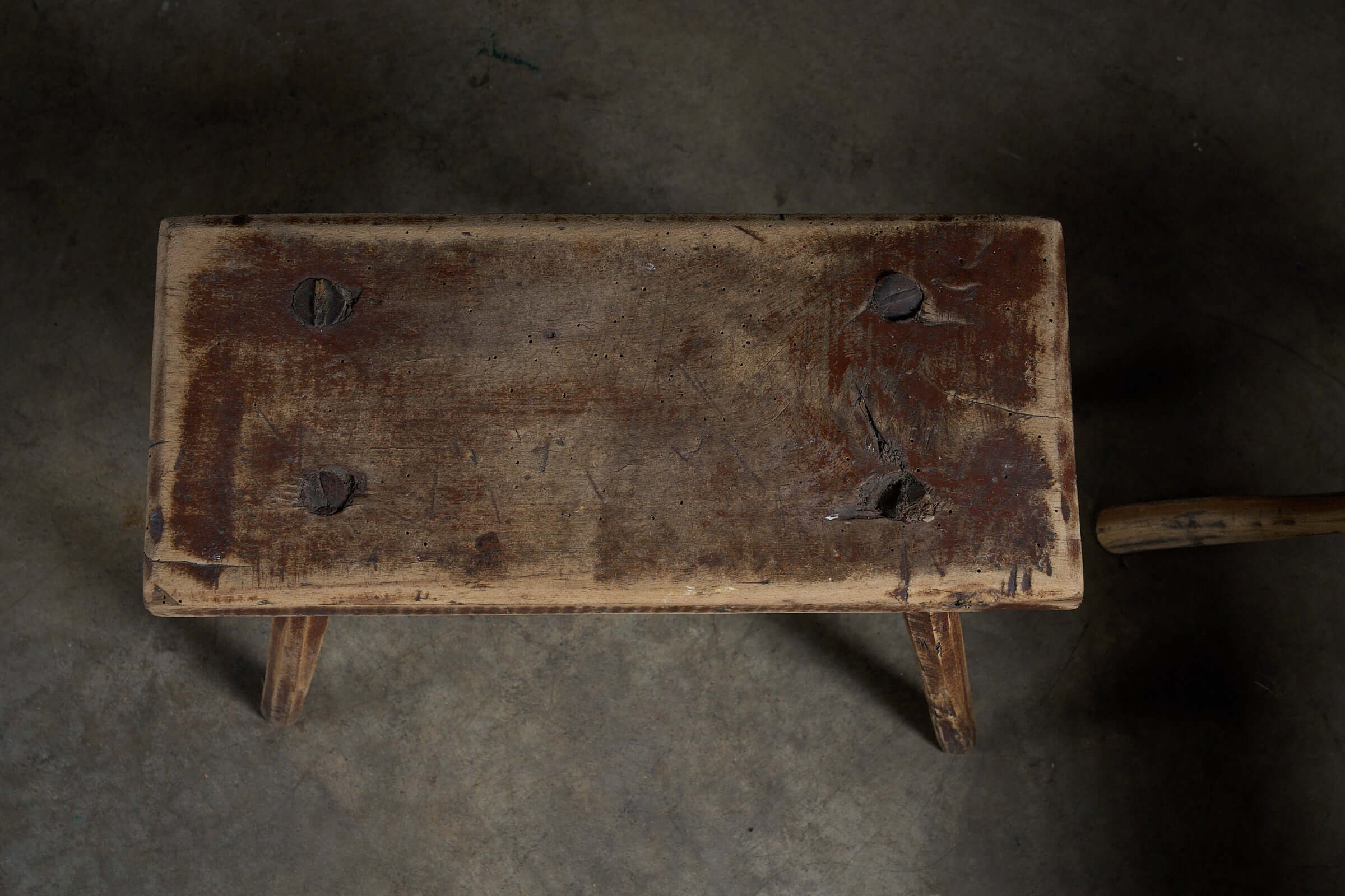 Antique Wooden Stools with textured surface and historic marks, perfect as low side tables or plant displays.