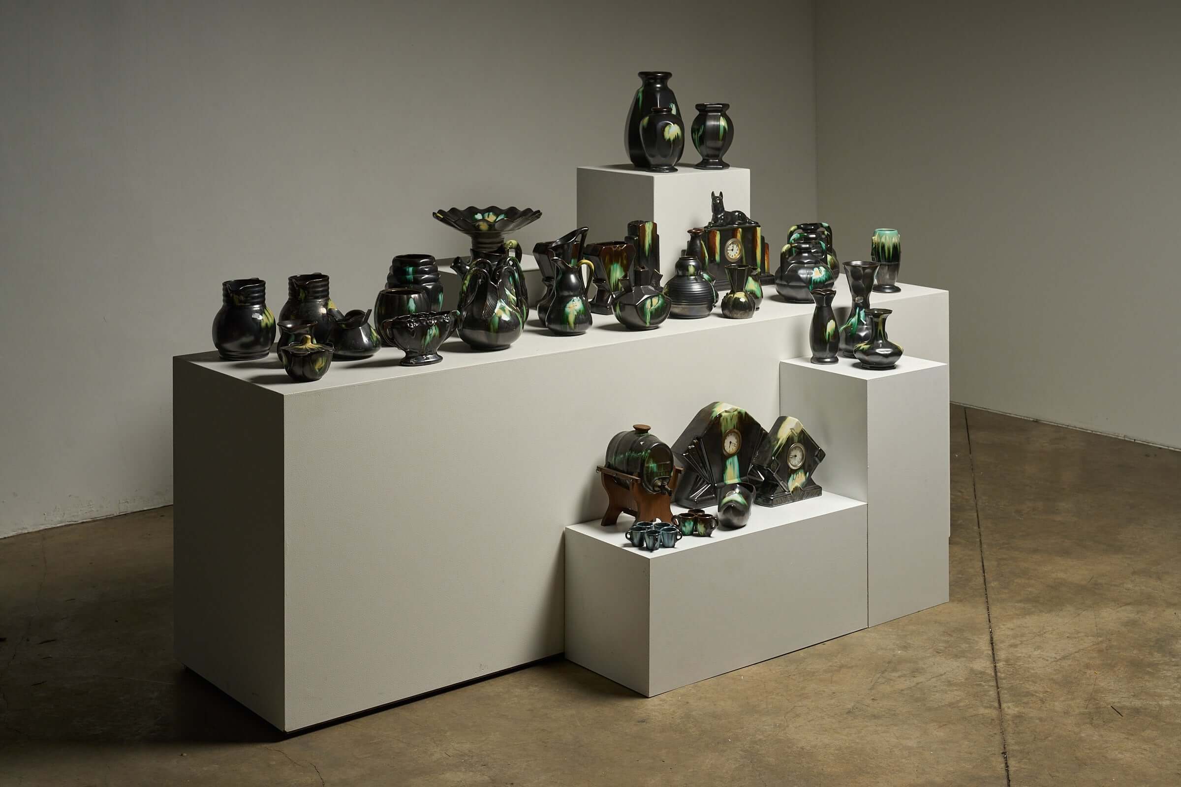 Large Collection of Belgian Art Deco Drip Glaze Ceramics 1920s showcased on a modern display.